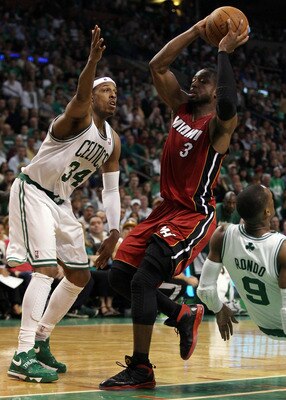 BOSTON, MA - MAY 07:  Dwyane Wade #3 of the Miami Heat heads for the basket as Rajon Rondo #9 and Paul Pierce #34 of the Boston Celtics defend in Game Three of the Eastern Conference Semifinals in the 2011 NBA Playoffs on May 7, 2011 at the TD Garden in B