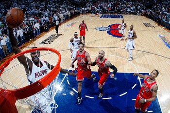 ATLANTA, GA - MAY 06:  Marvin Williams #24 of the Atlanta Hawks dunks against Derrick Rose #1, Joakim Noah #13 and Carlos Boozer #5 of the Chicago Bulls in Game Three of the Eastern Conference Semifinals in the 2011 NBA Playoffs at Phillips Arena on May 6