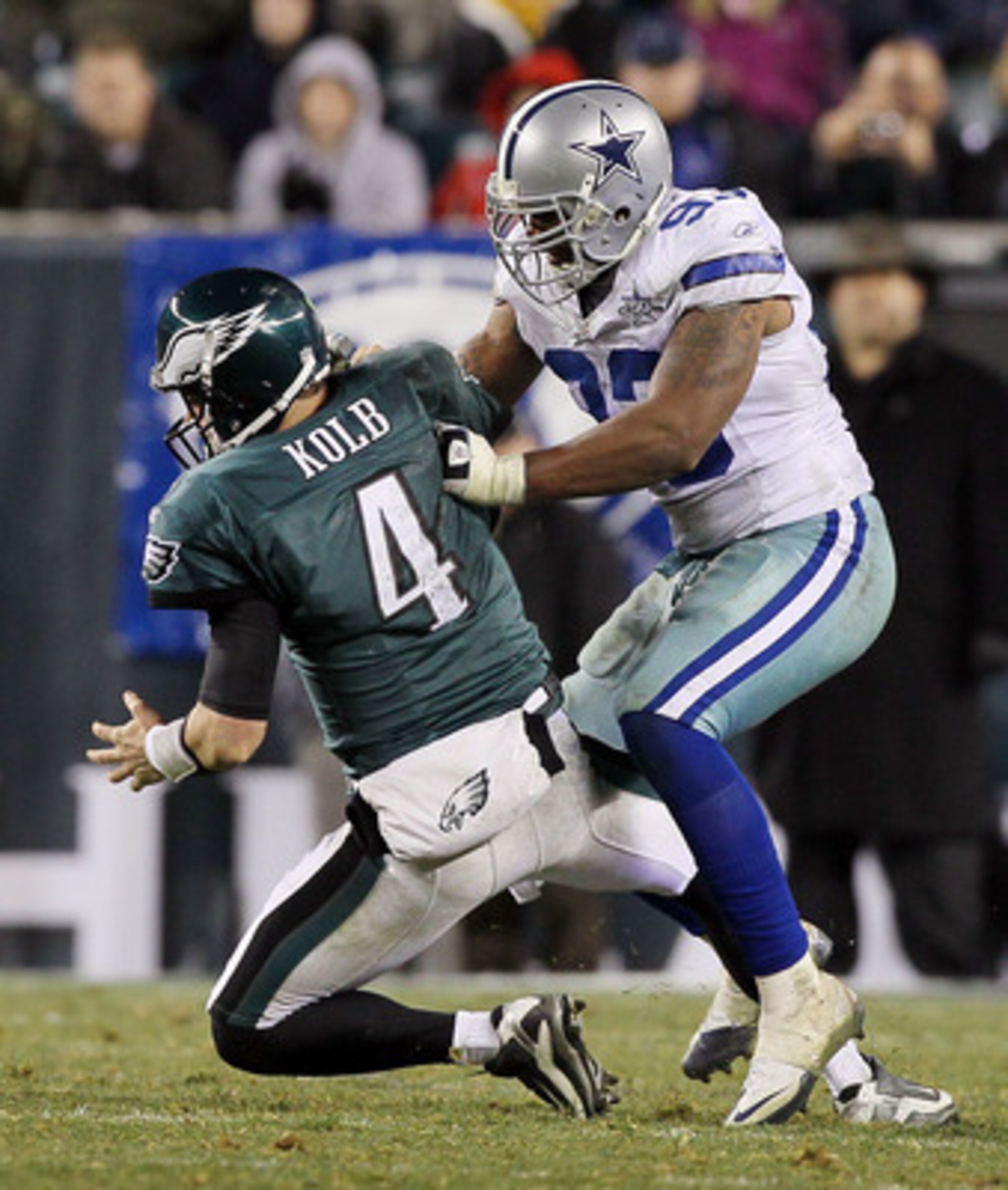 PHILADELPHIA, PA - JANUARY 02:  Kevin Kolb #4 of the Philadelphia Eagles is sacked by Anthony Spencer #93 of the Dallas Cowboys on January 2, 2011 at Lincoln Financial Field in Philadelphia, Pennsylvania. The Cowboys defeated the Eagles 14-13.  (Photo by