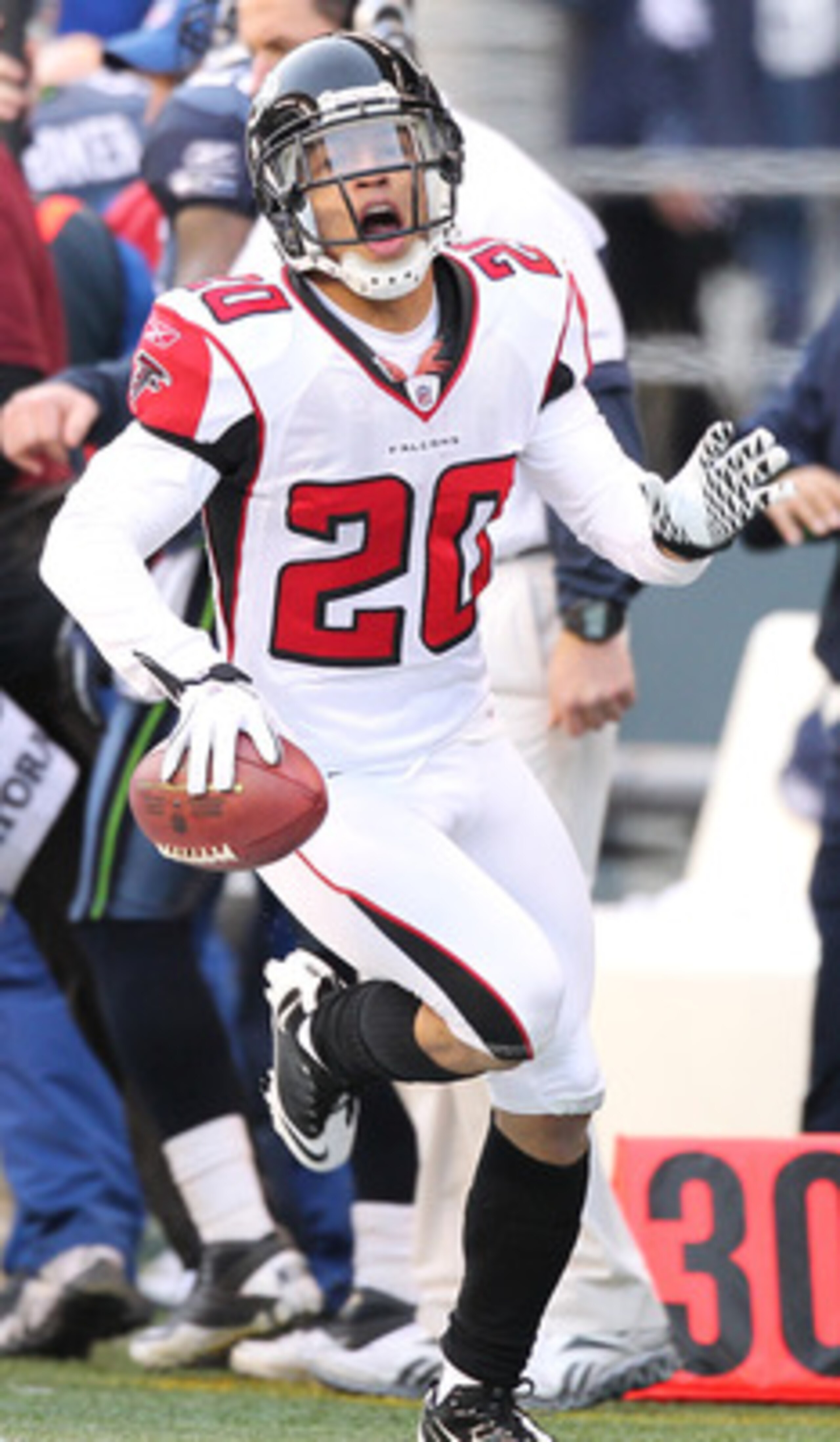 SEATTLE, WA - DECEMBER 19:  Brent Grimes #20 of the Atlanta Falcons celebrates after making an interception against the Seattle Seahawks at Qwest Field on December 19, 2010 in Seattle, Washington. The Falcons defeated the Seahawks 34-18. (Photo by Otto Gr