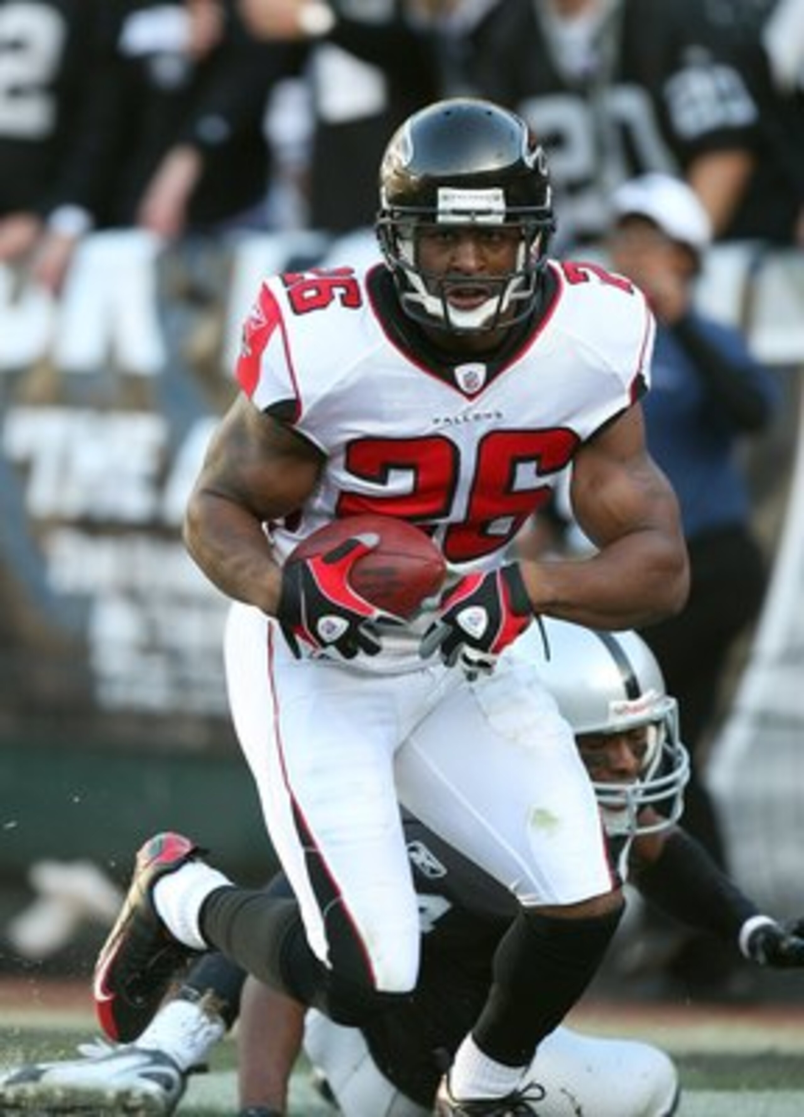 OAKLAND, CA - NOVEMBER 2:  Erik Coleman #26 of the Atlanta Falcons runs with the ball during the game against the Oakland Raiders on November 2, 2008 at the Oakland-Alameda County Coliseum in Oakland, California. The Falcons defeated the Raiders 24-0. (Ph