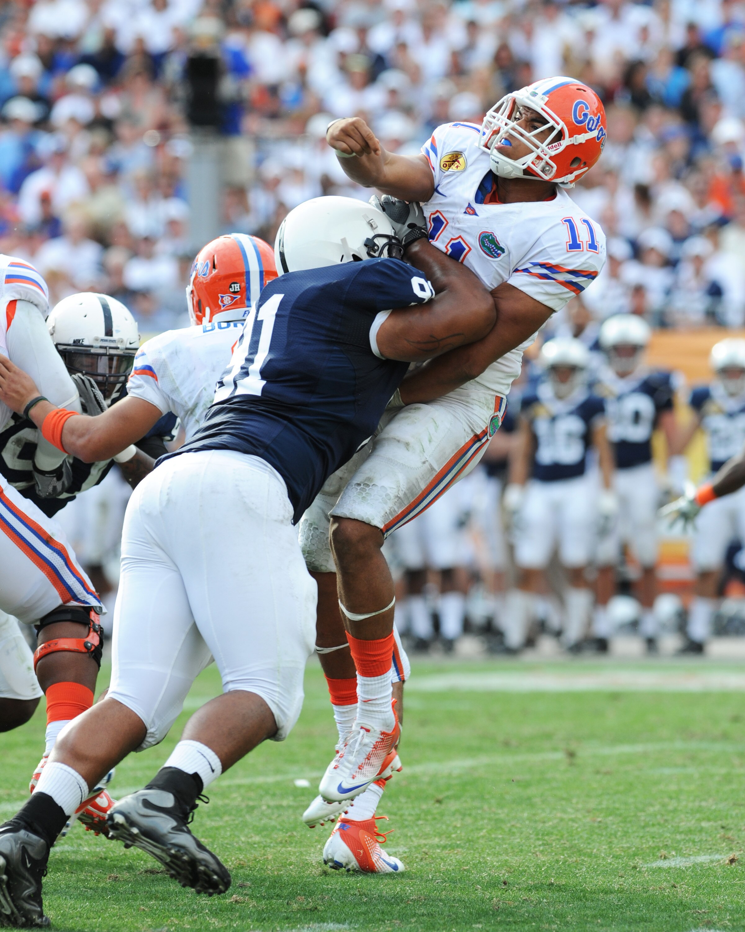 TAMPA, FL - JANUARY 1:  Linebacker DaQuan Jones #91 of the Penn State Nittany Lions tackles quarterback Tyler Murphy #11 of the Florida Gators January 1, 2011 in the 25th Outback Bowl at Raymond James Stadium in Tampa, Florida.  (Photo by Al Messerschmidt