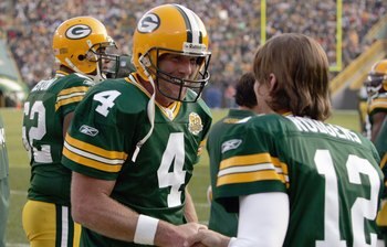 GREEN BAY, WI - NOVEMBER 11: Brett Favre #4 of the Green Bay Packers talks with  Aaron Rodgers #12 during the game against the Minnesota Vikings give chase on November 11, 2007 at Lambeau Field in Green Bay, Wisconsin. (Photo by Jonathan Daniel/Getty Imag