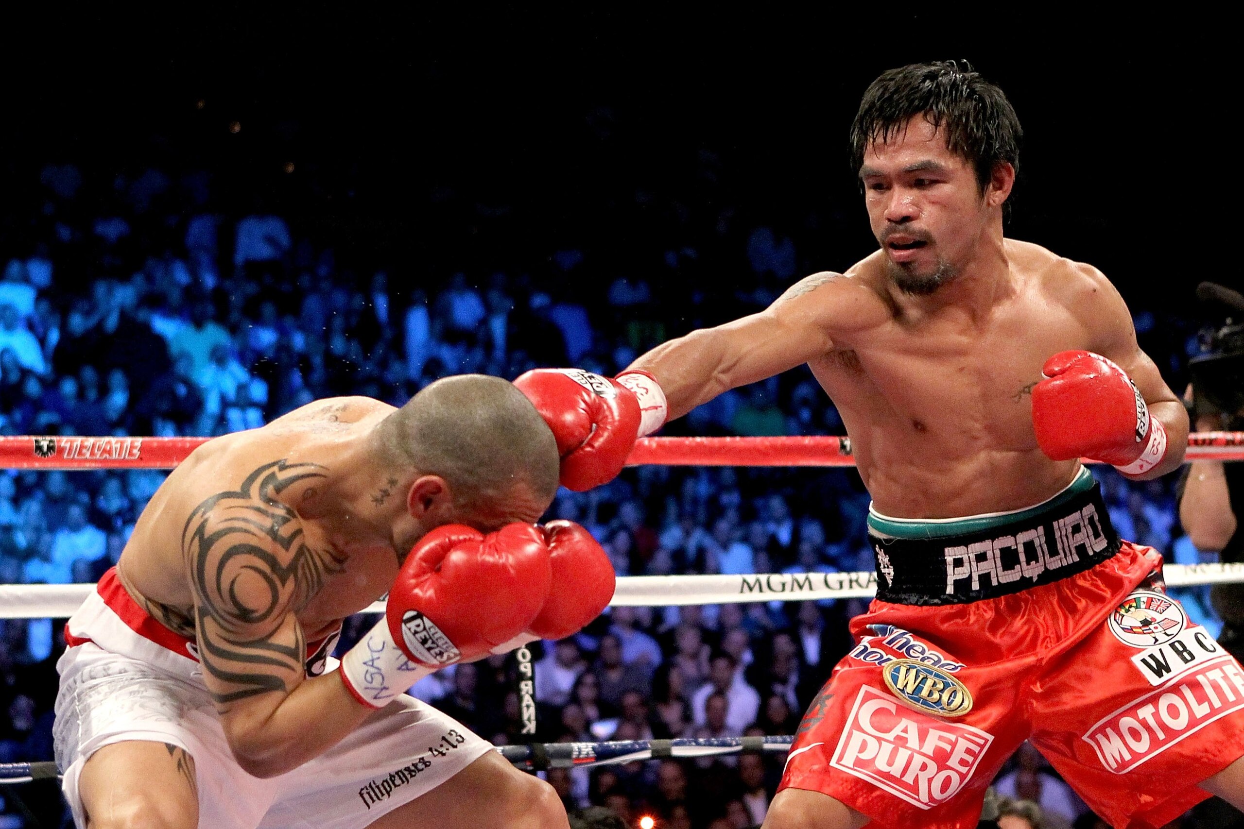 LAS VEGAS - NOVEMBER 14:  (R-L) Manny Pacquiao throws a right to the head of Miguel Cotto during their WBO welterweight title fight at the MGM Grand Garden Arena on November 14, 2009 in Las Vegas, Nevada.  (Photo by Al Bello/Getty Images)