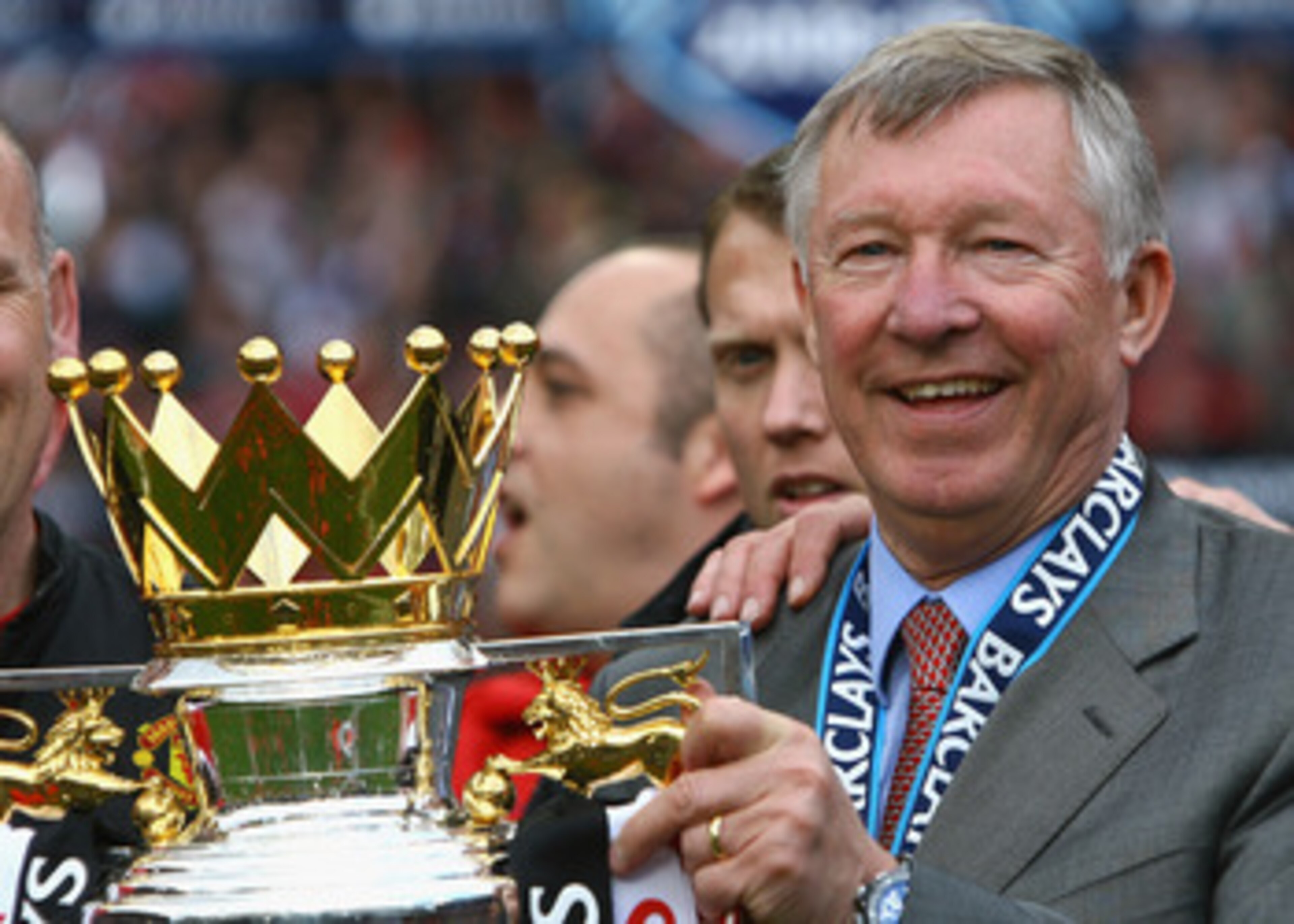 MANCHESTER, ENGLAND - MAY 16:  Manchester United Manager Sir Alex Ferguson celebrates with the Barclays Premier League trophy after his side won the Premier League title at the end of the Barclays Premier League match between Manchester United and Arsenal
