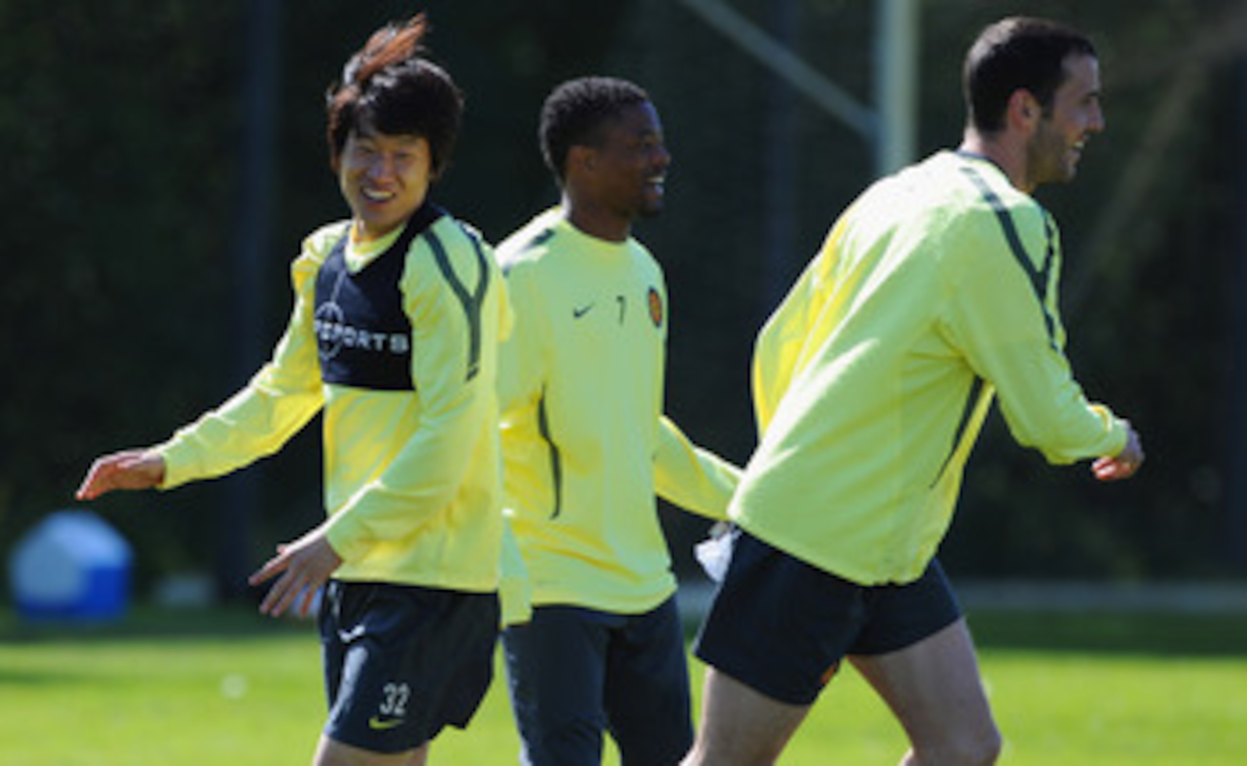 MANCHESTER, ENGLAND - MAY 03: Park Ji-Sung, Patrice Evra and John O'Shea look on during a training session ahead of their UEFA Champions League semi final second leg match against Schalke 04 at the Carrington Training Ground on May 3, 2011 in Manchester,