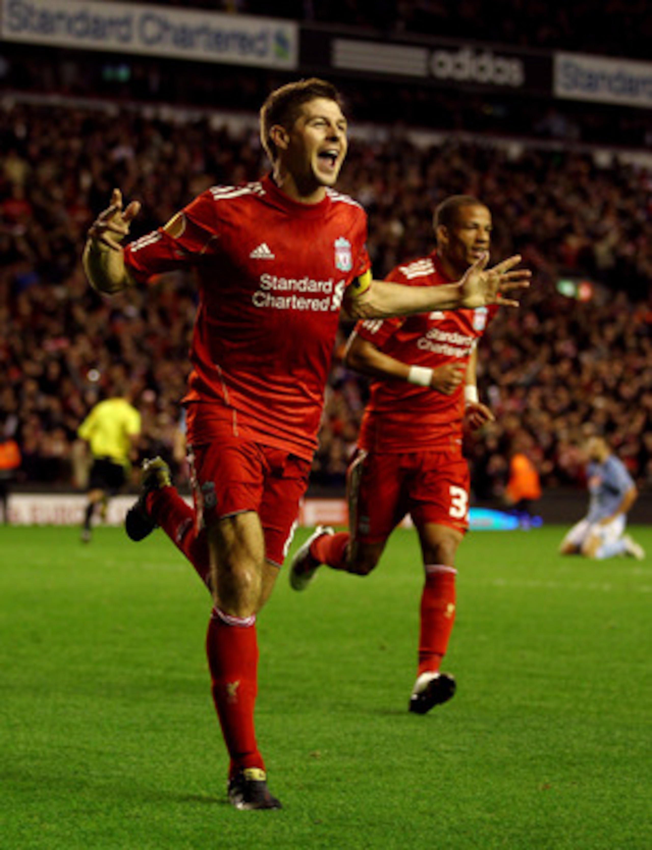 LIVERPOOL, ENGLAND - NOVEMBER 04:  Steven Gerrard of Liverpool celebrates scoring his team's third goal and his hat trick during the UEFA Europa League Group K match beteween Liverpool and SSC Napoli at Anfield on November 4, 2010 in Liverpool, England.  
