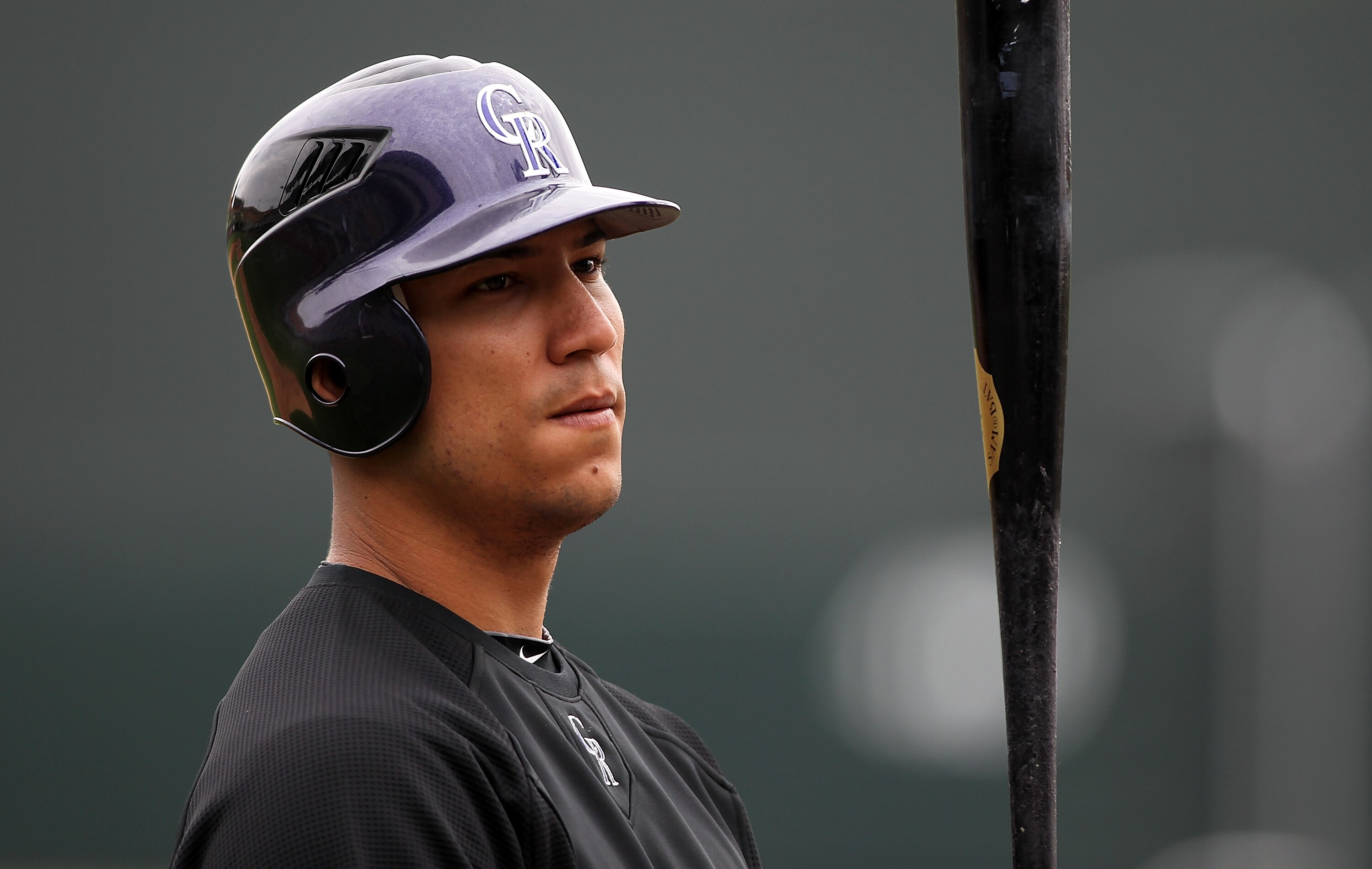 SCOTTSDALE, AZ - FEBRUARY 26:  Carlos Gonzalez #5 of the Colorado Rockies watches batting practice before the game against the Arizona Diamondbacks at Salt River Fields on February 26, 2011in Scottsdale, Arizona..  (Photo by Jonathan Ferrey/Getty Images)
