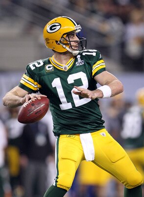 ARLINGTON, TX - FEBRUARY 06:  Aaron Rodgers #12 of the Green Bay Packers throws a pass against the Pittsburgh Steelers during Super Bowl XLV at Cowboys Stadium on February 6, 2011 in Arlington, Texas. The Packers won 31-25. (Photo by Jamie Squire/Getty Im