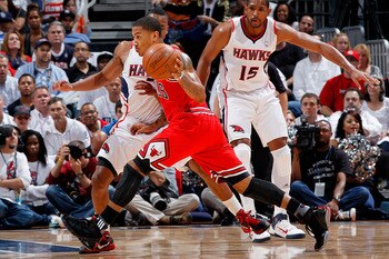 ATLANTA, GA - MAY 06:  Derrick Rose #1 of the Chicago Bulls drives against Jeff Teague #0 of the Atlanta Hawks in Game Three of the Eastern Conference Semifinals in the 2011 NBA Playoffs at Phillips Arena on May 6, 2011 in Atlanta, Georgia.  NOTE TO USER: