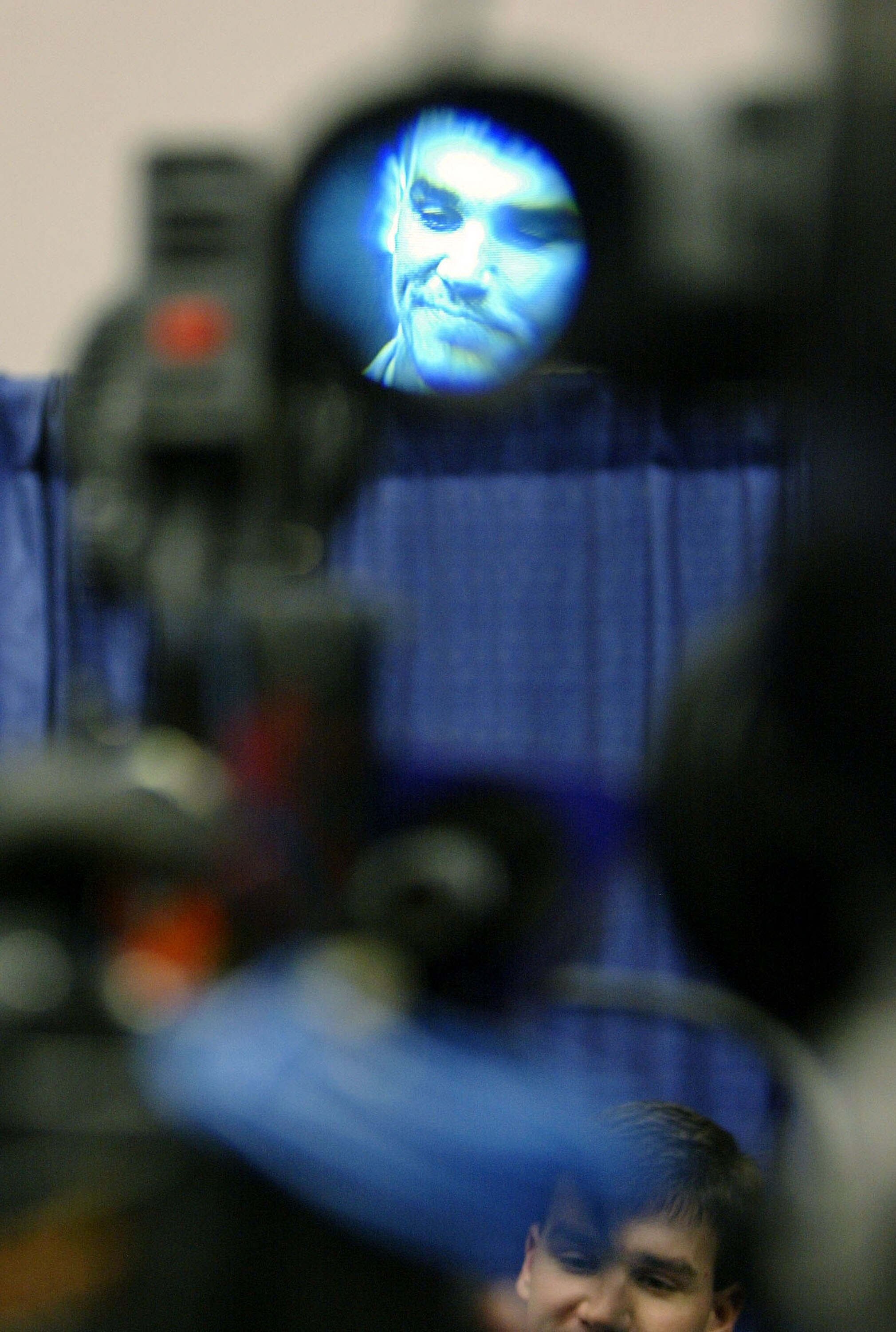 HOUSTON - JANUARY 26:  Quarterback Jake Delhomme of the Carolina Panthers is seen through the view finder of a television camera as he answers questions from the media as a television camera rolls before Super Bowl XXXVIII against the New England Patriots