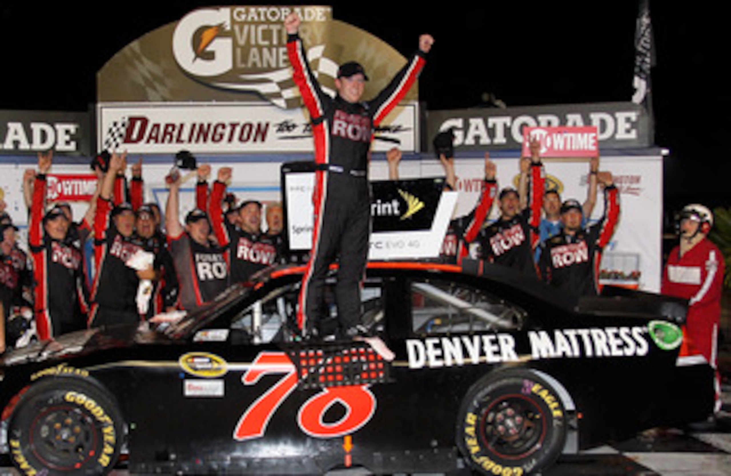 DARLINGTON, SC - MAY 07:  Regan Smith, driver of the #78 Furniture Row Companies Chevrolet, celebrates in Victory Lane after winning the NASCAR Sprint Cup Series SHOWTIME Southern 500 at Darlington Raceway on May 7, 2011 in Darlington, South Carolina.  (P