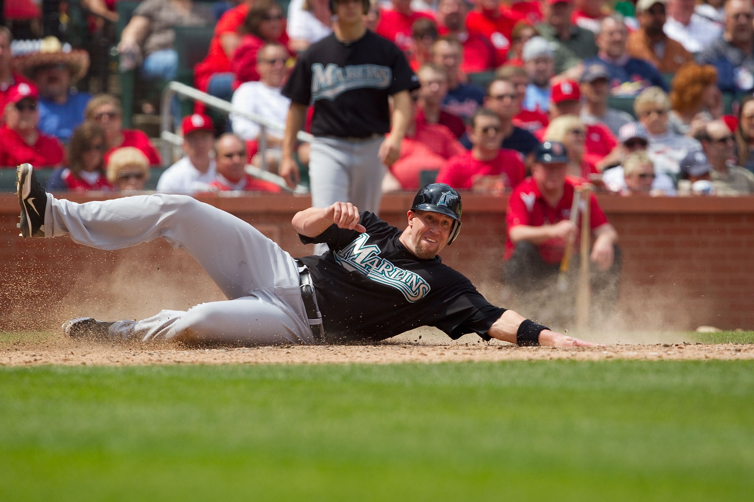 ST. LOUIS, MO - MAY 5: John Buck #14 of the Florida Marlins scores a run aSt. Louis Cardinals at Busch Stadium on May 5, 2011 in St. Louis, Missouri.  (Photo by Dilip Vishwanat/Getty Images)