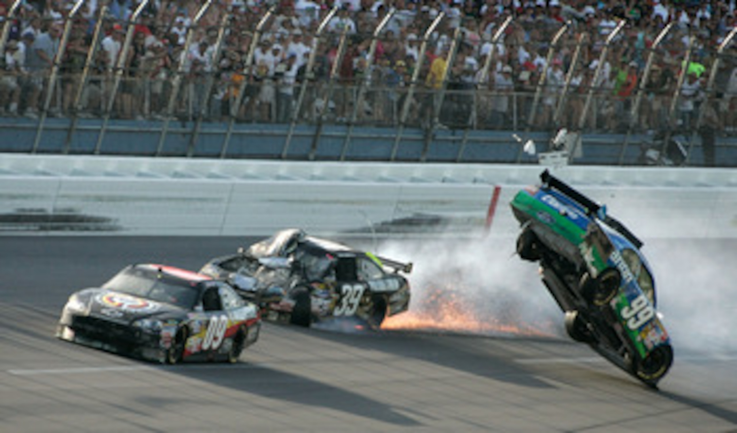 TALLADEGA, AL - APRIL 26:  Carl Edwards, driver of the #99 Claritin Ford, goes airborne as Ryan Newman, driver of the #39 Steweart-Haas Racing Chevrolet suffers damage and Brad Keselowski, driver of the #09 Miccosukee Indian Gaming Chevrolet drives at the