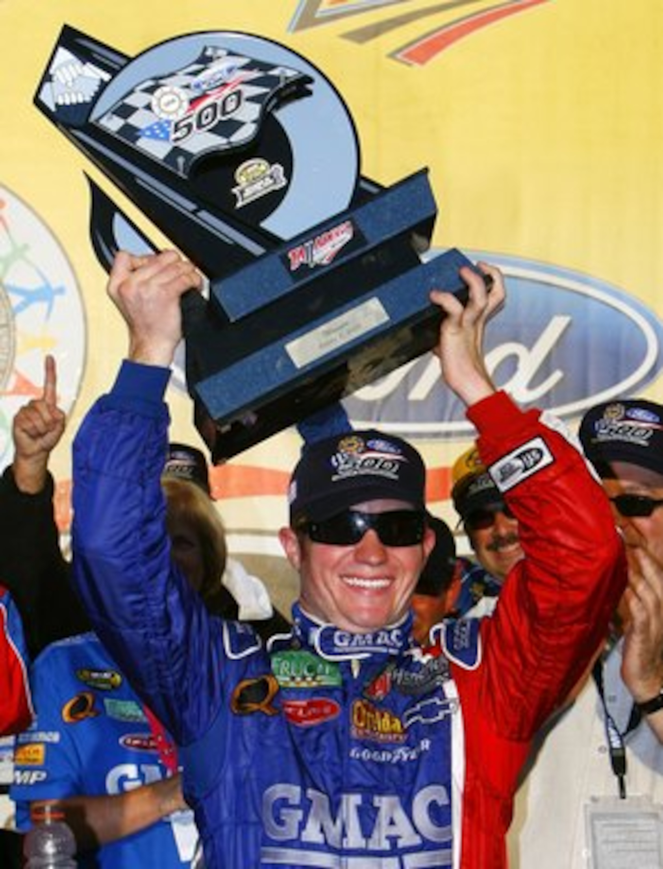 TALLADEGA, AL - OCTOBER 08:  Brian Vickers, driver of the #25 GMAC Chevrolet, holds the winners trophy in victory lane, following the NASCAR Nextel Cup Series UAW-Ford 500 on October 8, 2006 at Talladega Superspeedway in Talladega, Alabama.  (Photo by Rus