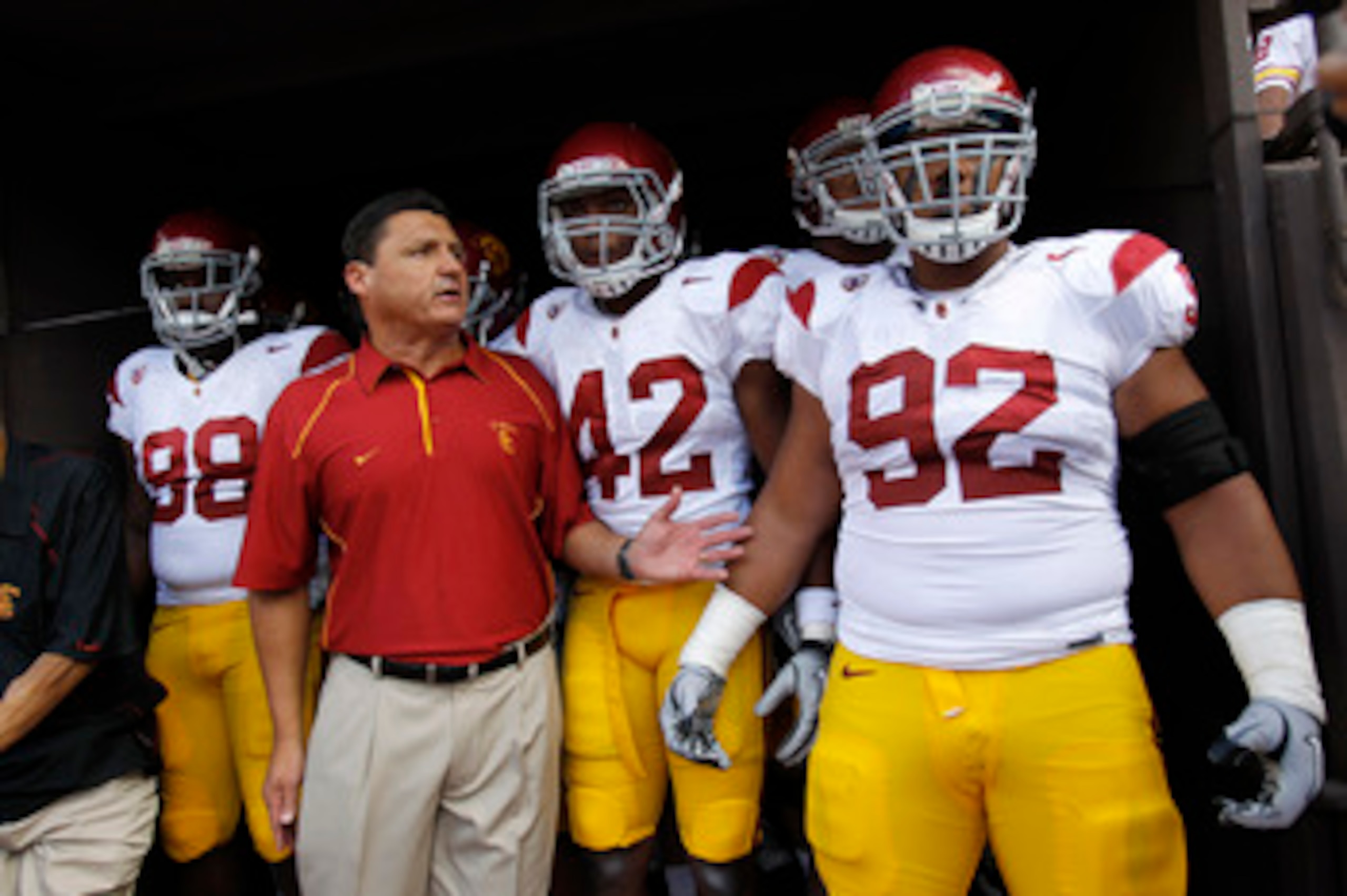 HONOLULU - SEPTEMBER 02:  Defensive and Recruiting Coordinator Ed Orgeron of the University of Souther California Trojans leads the team to the edge of the tunnel before the start of the Trojan's season opener against the Hawaii Warriors at Aloha Stadium