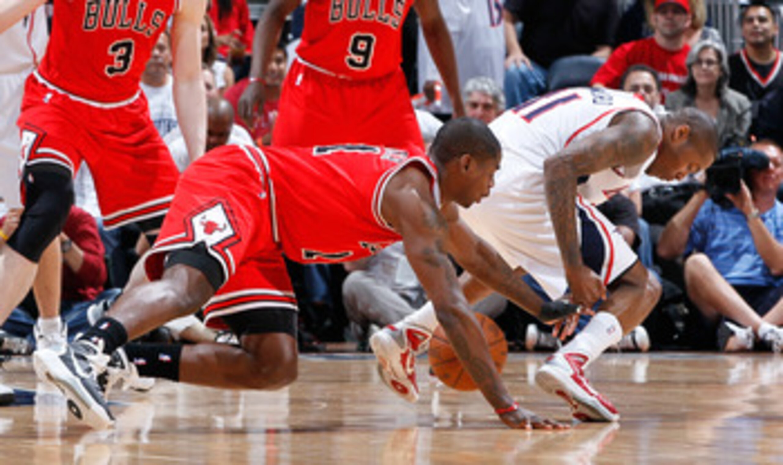 ATLANTA, GA - MAY 06:  Jamal Crawford #11 of the Atlanta Hawks loses the ball against Ronnie Brewer #11 of the Chicago Bulls in Game Three of the Eastern Conference Semifinals in the 2011 NBA Playoffs at Phillips Arena on May 6, 2011 in Atlanta, Georgia. 