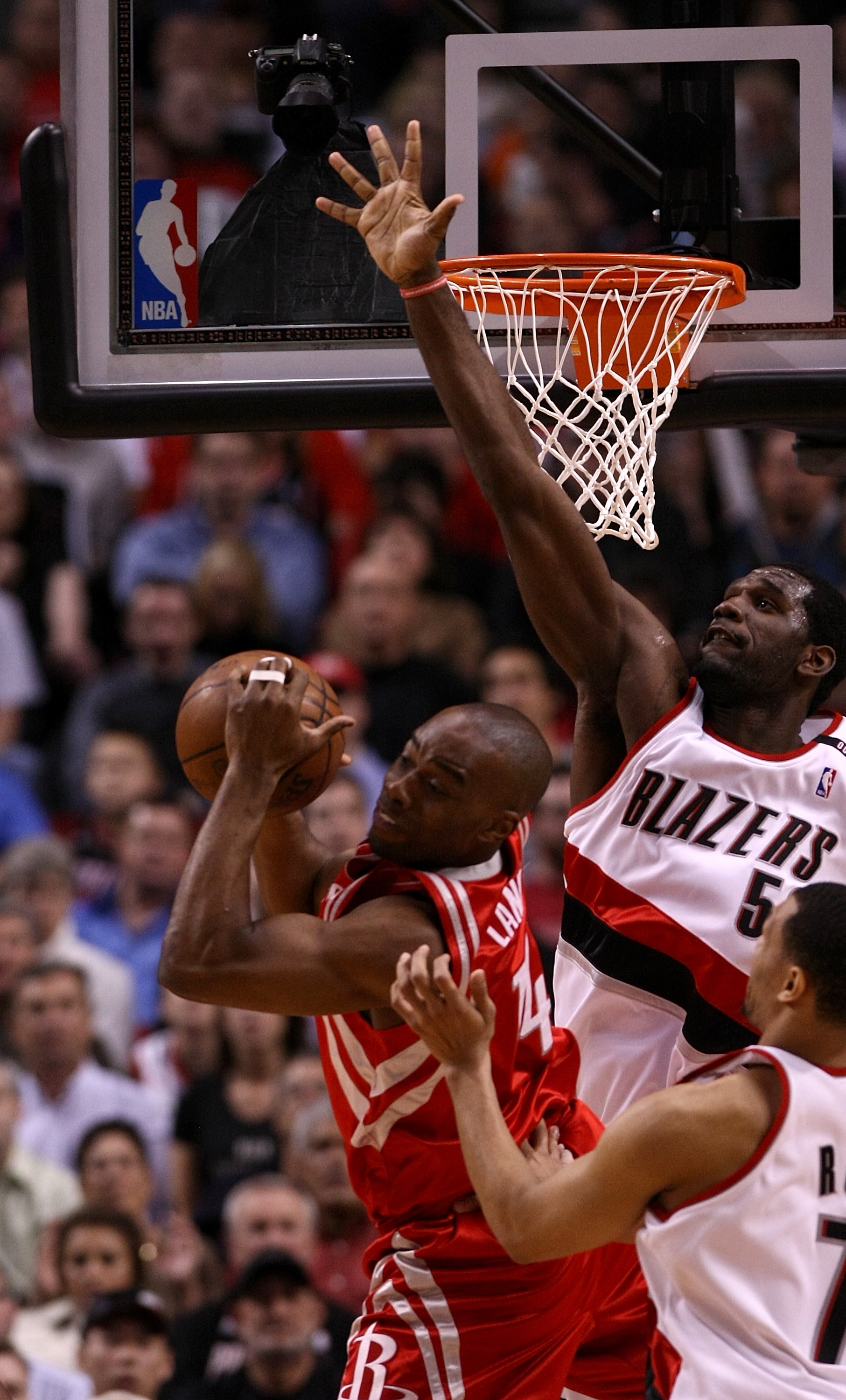 PORTLAND, OR - APRIL 28:  Carl Landry #14 of the Houston Rockets is guarded by Greg Oden #52 of the Portland Trail Blazers during Game 5 of the Western Conference Quarterfinals of the NBA Playoffs on April 28, 2009 at the Rose Garden in Portland, Oregon.
