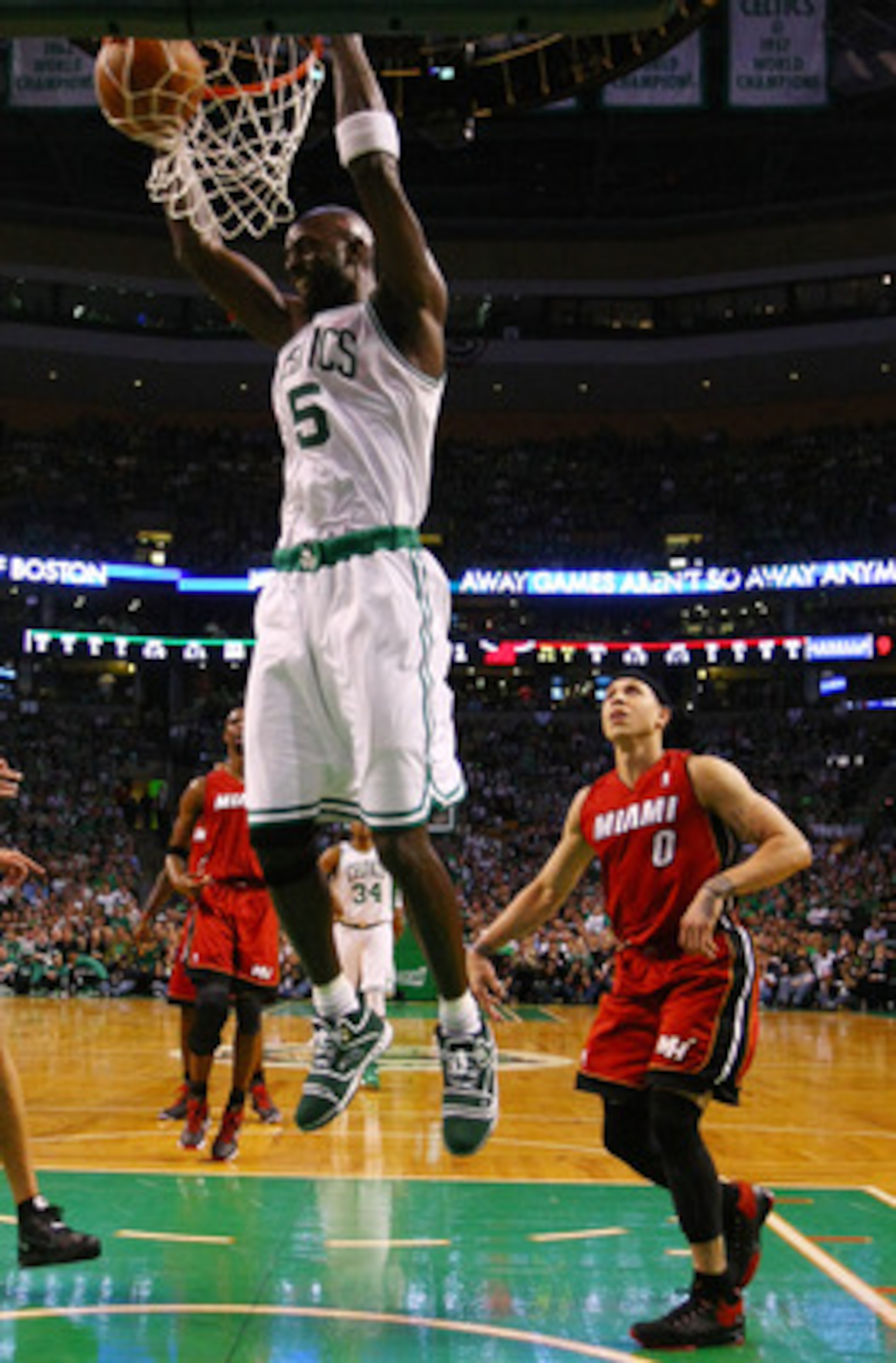 BOSTON, MA - MAY 07: Kevin Garnett #5 of the Boston Celtics dunks the ball as Mike Bibby #0 of the Miami Heat defends in Game Three of the Eastern Conference Semifinals in the 2011 NBA Playoffs on May 7, 2011 at the TD Garden in Boston, Massachusetts.  NO