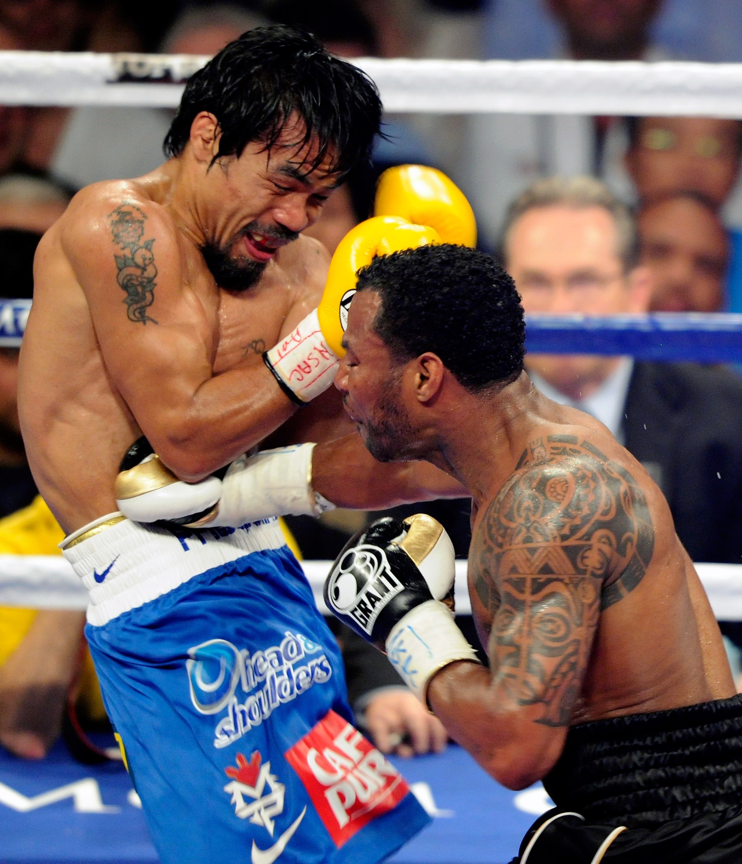 LAS VEGAS, NV - MAY 07:  Shane Mosley (R) hits Manny Pacquiao in the fifth round of their WBO welterweight title fight at the MGM Grand Garden Arena May 7, 2011 in Las Vegas, Nevada. Pacquiao retained his title with a unanimous-decision victory.  (Photo b