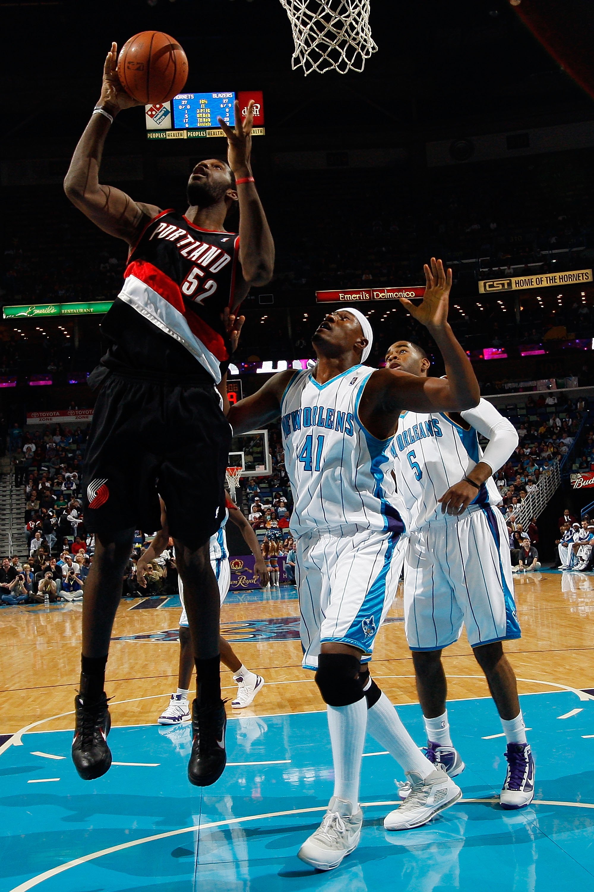 NEW ORLEANS - NOVEMBER 13:  Greg Oden #52 of the Portland Trail Blazers grabs a rebound over James Posey #41 of the New Orleans Hornets  at the New Orleans Arena on November 13, 2009 in New Orleans, Louisiana.  NOTE TO USER: User expressly acknowledges an