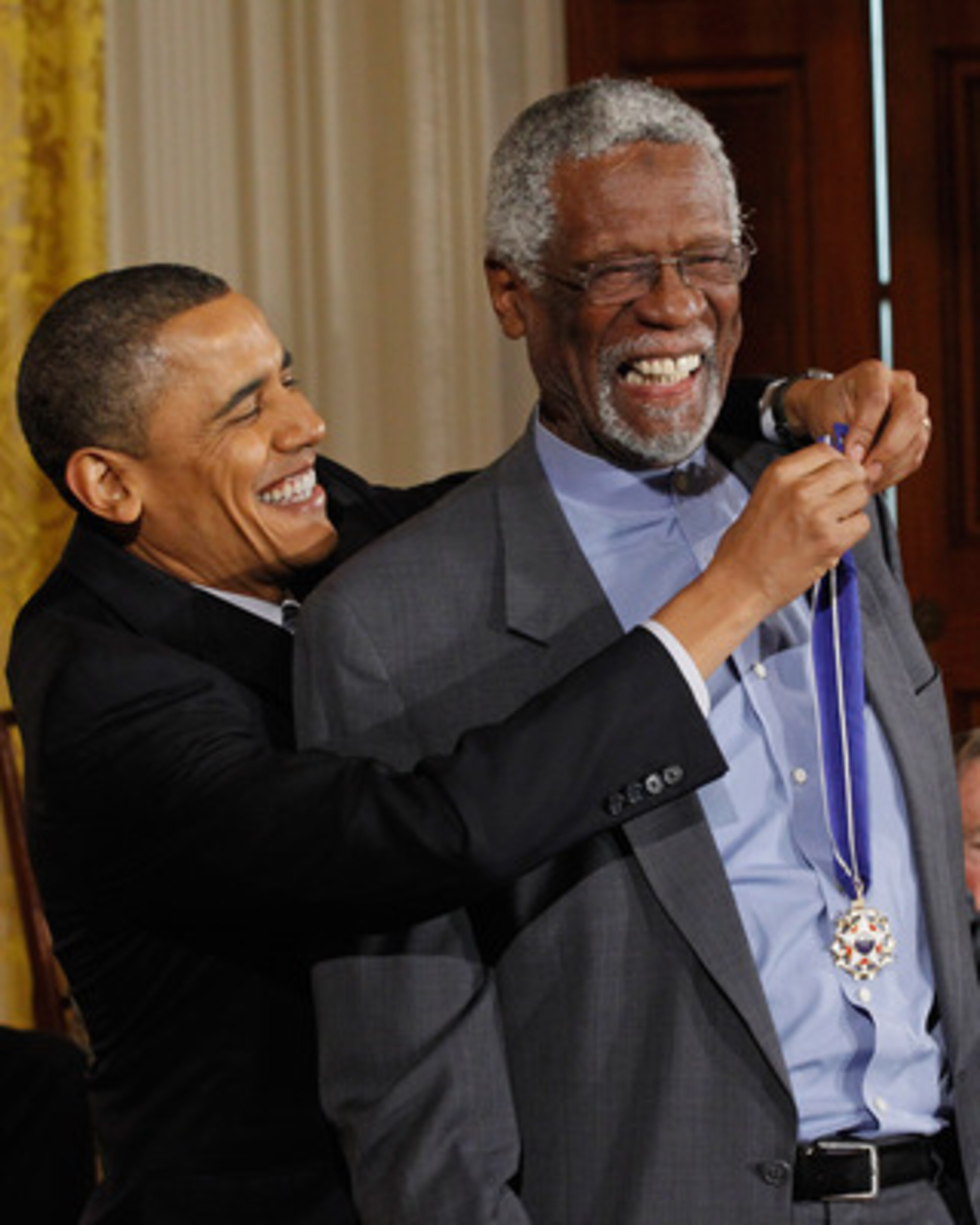 WASHINGTON, DC - FEBRUARY 15:  U.S. President Barack Obama (L) presents Basetball Hall of Fame member and human rights advocate Bill Russell the 2010 Medal of Freedom in the East Room of the White House February 15, 2011 in Washington, DC. Obama presented