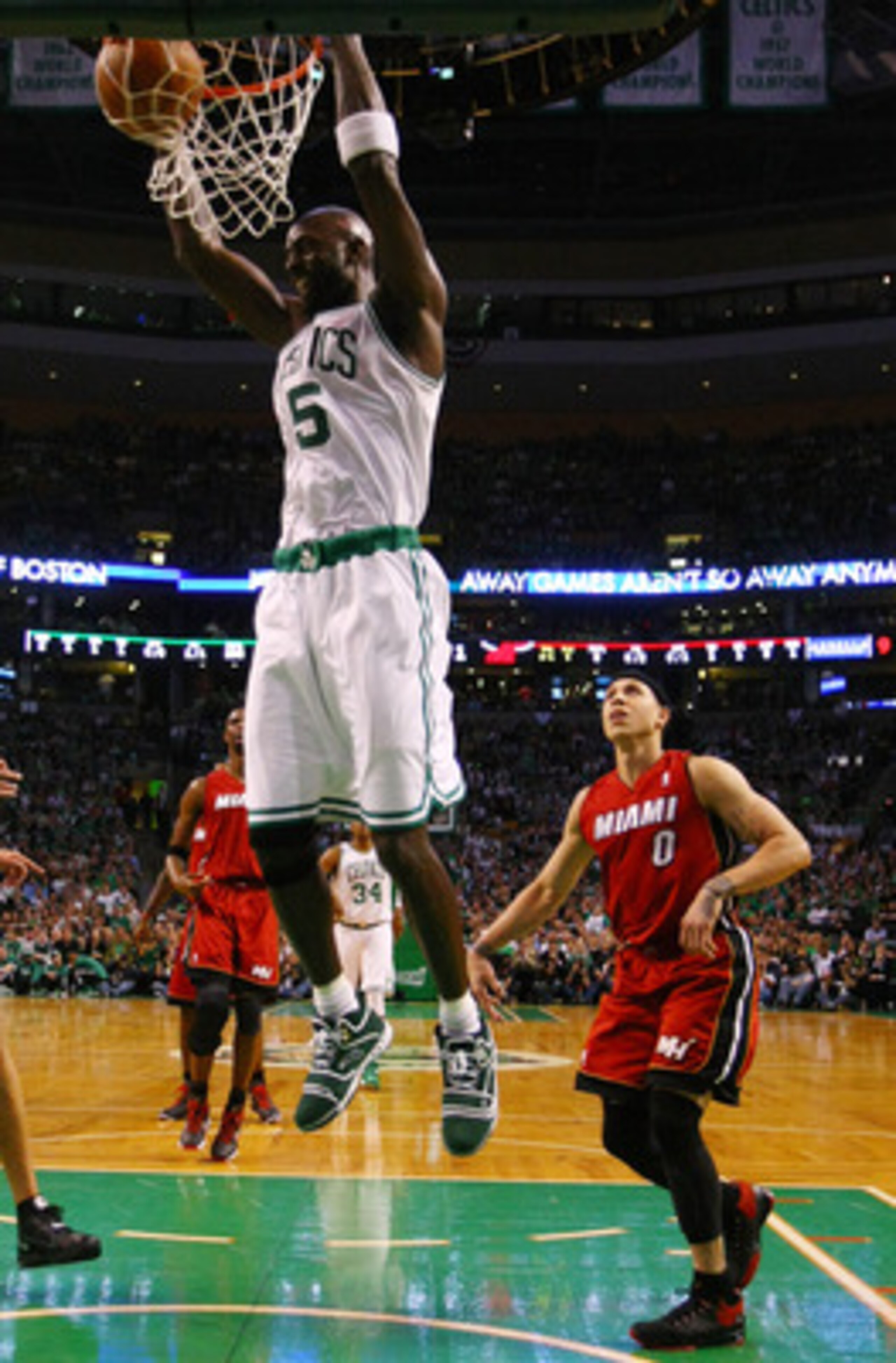 BOSTON, MA - MAY 07: Kevin Garnett #5 of the Boston Celtics dunks the ball as Mike Bibby #0 of the Miami Heat defends in Game Three of the Eastern Conference Semifinals in the 2011 NBA Playoffs on May 7, 2011 at the TD Garden in Boston, Massachusetts.  NO