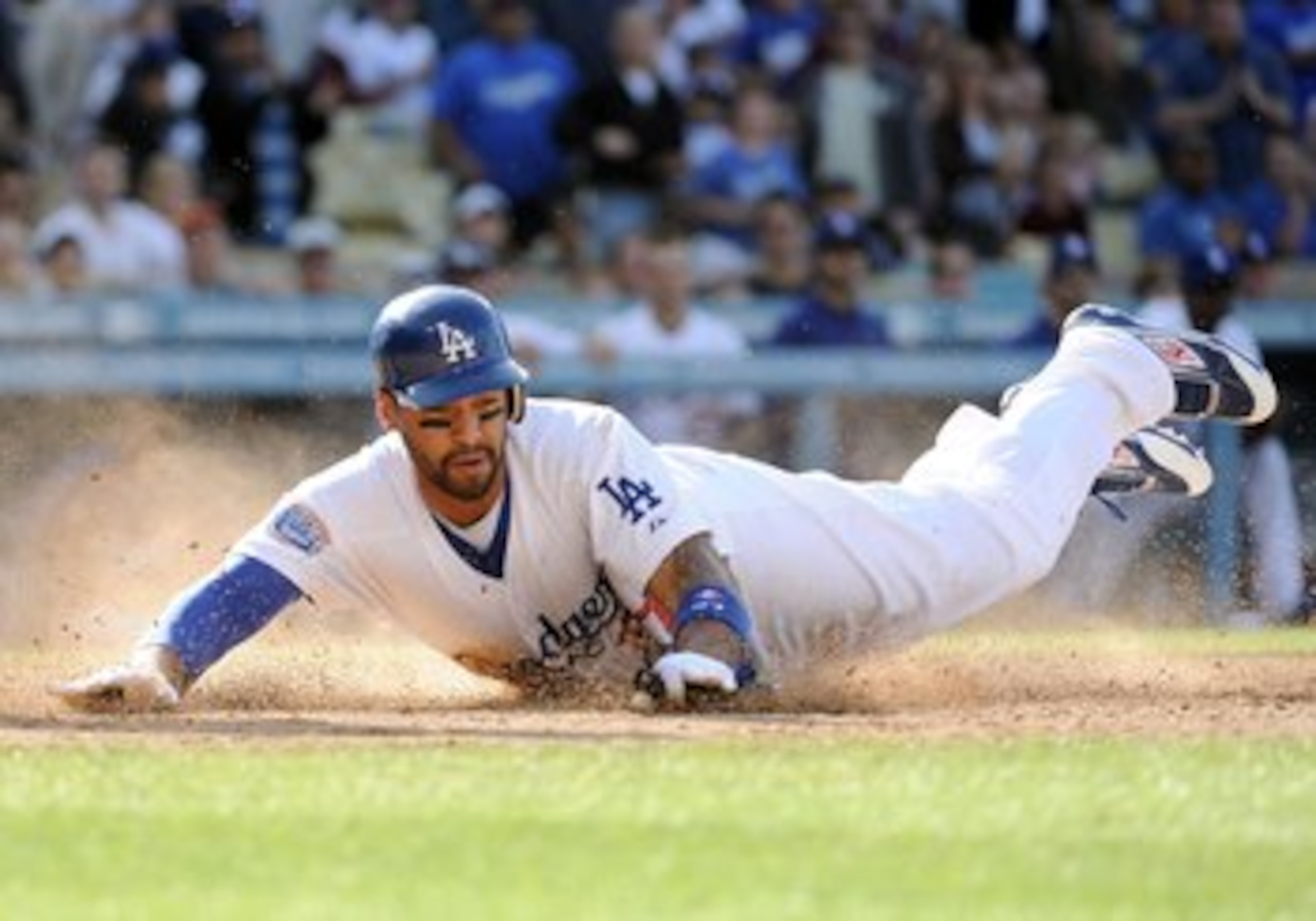LOS ANGELES, CA - MAY 22:  Matt Kemp #27 of the Los Angeles Dodgers dives home to score a run against the Detroit Tigers during the game at Dodger Stadium on May 22, 2010 in Los Angeles, California.  (Photo by Harry How/Getty Images)
