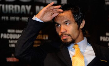 LAS VEGAS, NV - MAY 07:  Manny Pacquiao of the Philippines looks on during the post-fight news conference after Pacquiao defeated Shane Mosley by unanimous decision in the WBO welterweight title fight at MGM Grand Garden Arena on May 7, 2011 in Las Vegas,