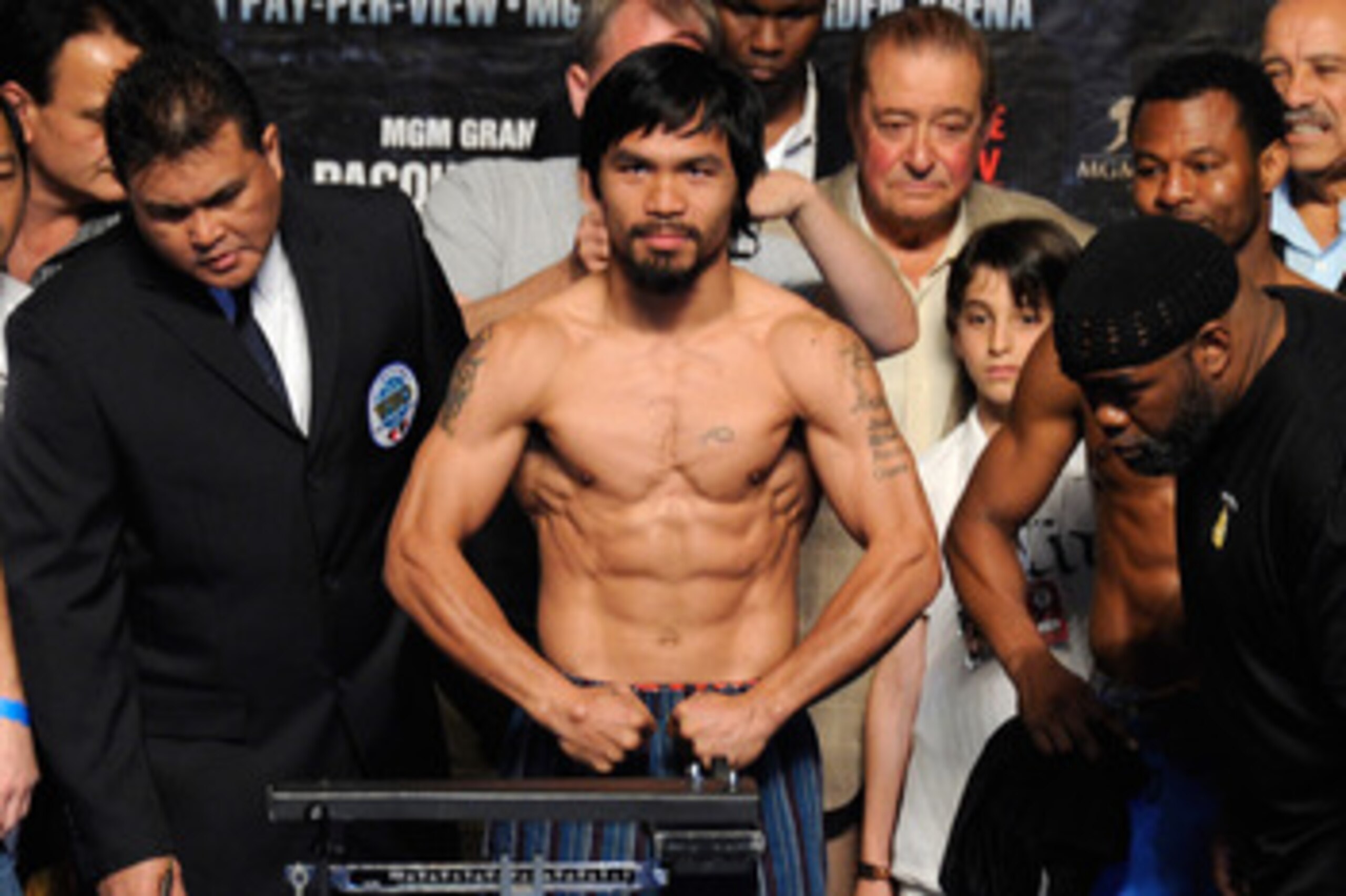 LAS VEGAS, NV - MAY 06:  Boxer Manny Pacquiao of the Philippines steps on the scale at 145 pounds before his WBO welterweight title fight against Shane Mosley at MGM Grand Garden Arena on May 6, 2011 in Las Vegas, Nevada. Pacquiao will defend his WBO welt