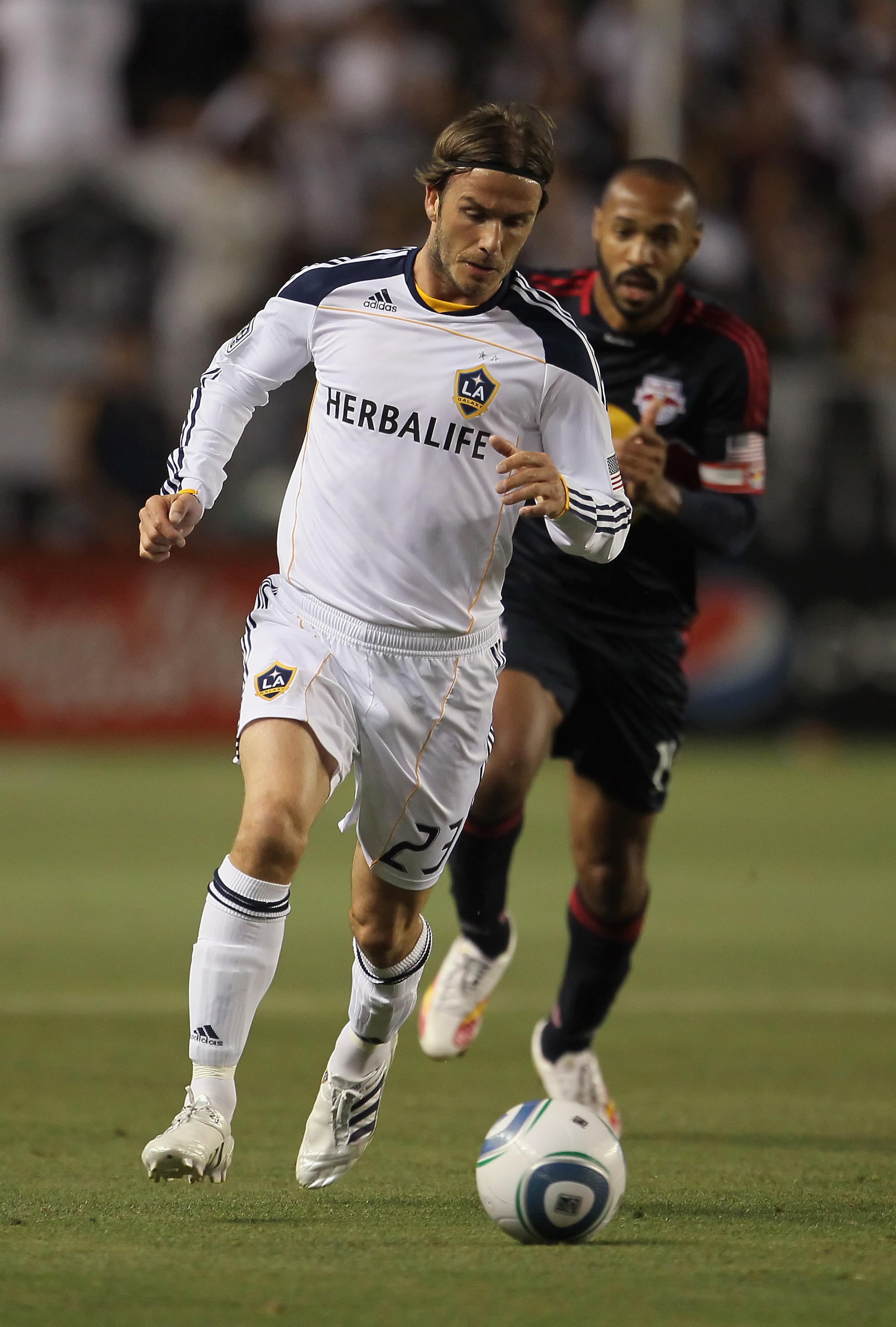 CARSON, CA - MAY 07:  David Beckham #23 of the Los Angeles Galaxy is pursued by Thierry Henry #14 of the New York Red Bulls in the first half at The Home Depot Center on May 7, 2011 in Carson, California. The Red Bulls and Galaxy played to a 1-1 draw.  (P