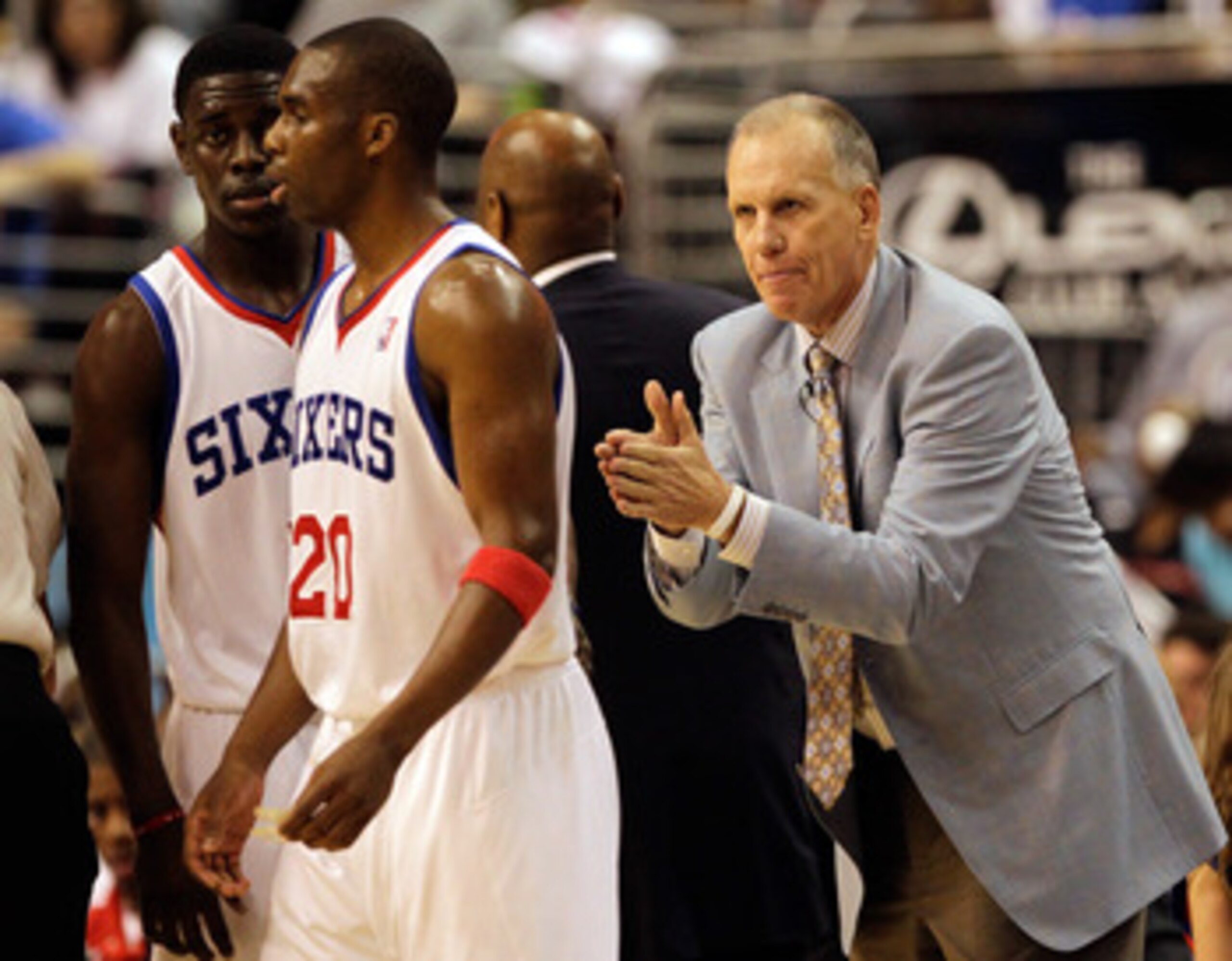 PHILADELPHIA, PA - APRIL 24: Coach Doug Collins of the Philadelphia 76ers gestures to players Jrue Holiday #11 (L) and Jodie Meeks #20 during the second half in Game Four of the Eastern Conference Quarterfinals in the 2011 NBA Playoffs at Wells Fargo Cent PHILADELPHIA, PA - APRIL 24: Coach Doug Collins of the Philadelphia 76ers gestures to players Jrue Holiday #11 (L) and Jodie Meeks #20 during the second half in Game Four of the Eastern Conference Quarterfinals in the 2011 NBA Playoffs at Wells Fargo Cent