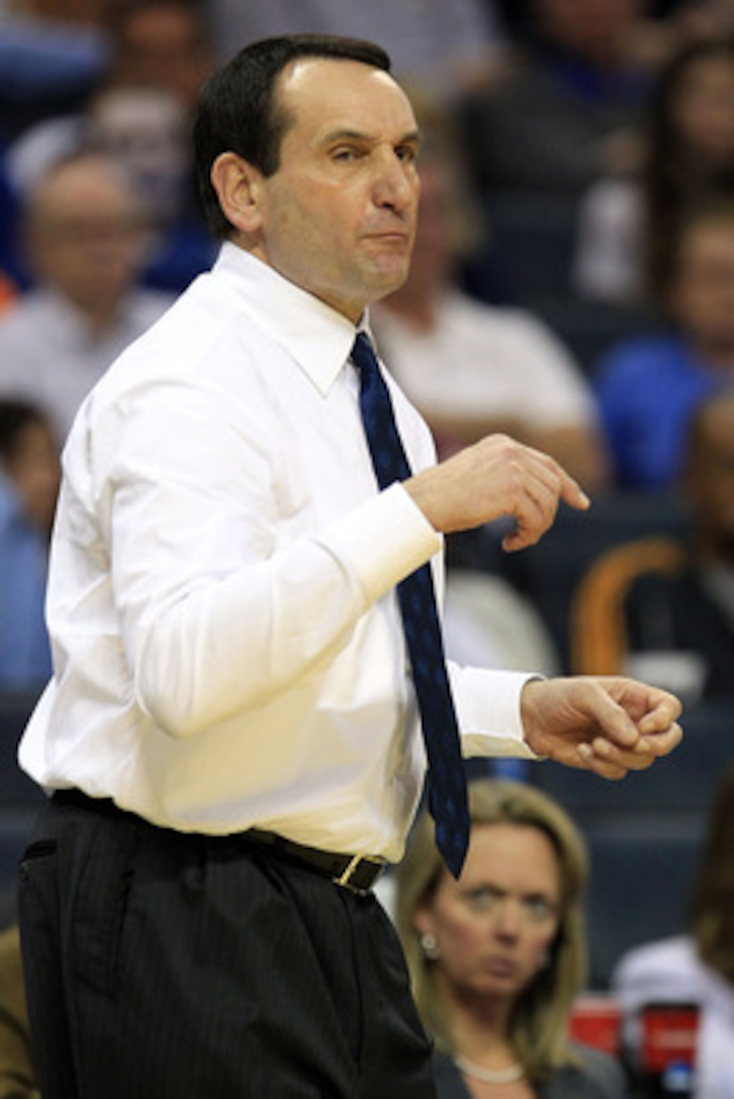 CHARLOTTE, NC - MARCH 20:  Head coach Mike Krzyzewski of the Duke Blue Devils reacts while taking on the Michigan Wolverines during the third round of the 2011 NCAA men's basketball tournament at Time Warner Cable Arena on March 20, 2011 in Charlotte, Nor