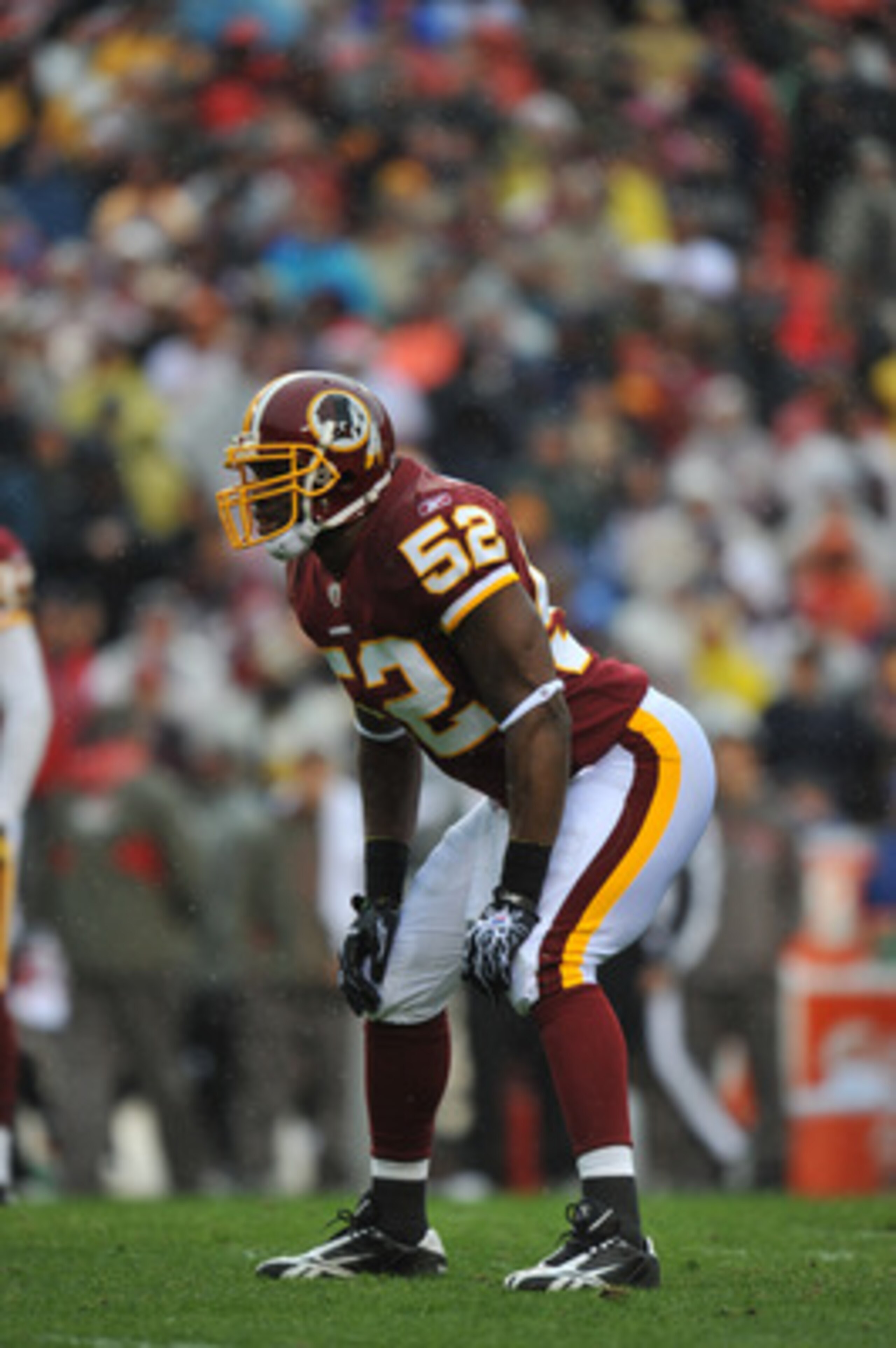 LANDOVER, MD - DECEMBER 12:  Rocky McIntosh #52 of the Washington Redskins defends against the Tampa Bay Buccaneers  at FedExField on December 12, 2010 in Landover, Maryland. The Buccaneers defeated the Redskins 17-16. (Photo by Larry French/Getty Images)