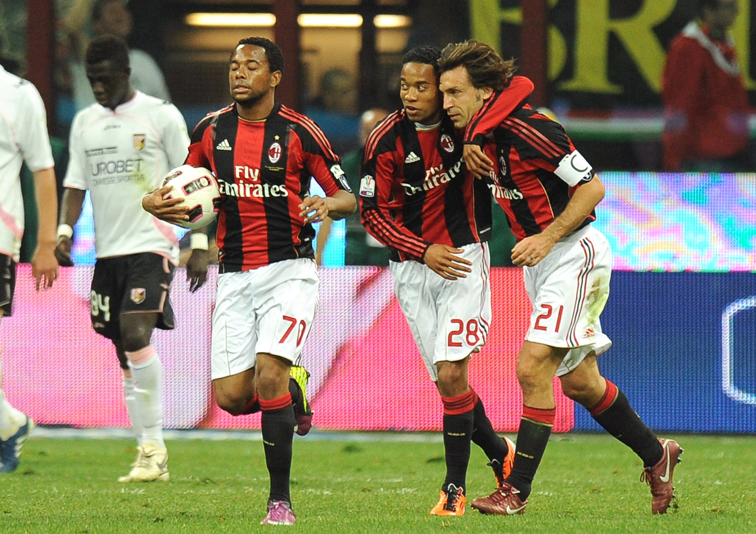 MILAN, ITALY - APRIL 20:  Urby Emanuelson (2nd-R) of Milan celebrates with mates after scoring the second equalizing goal (2-2) during the TIM Cup semifinal match between AC Milan and US Citta di Palermo at Stadio Giuseppe Meazza on April 20, 2011 in Mila