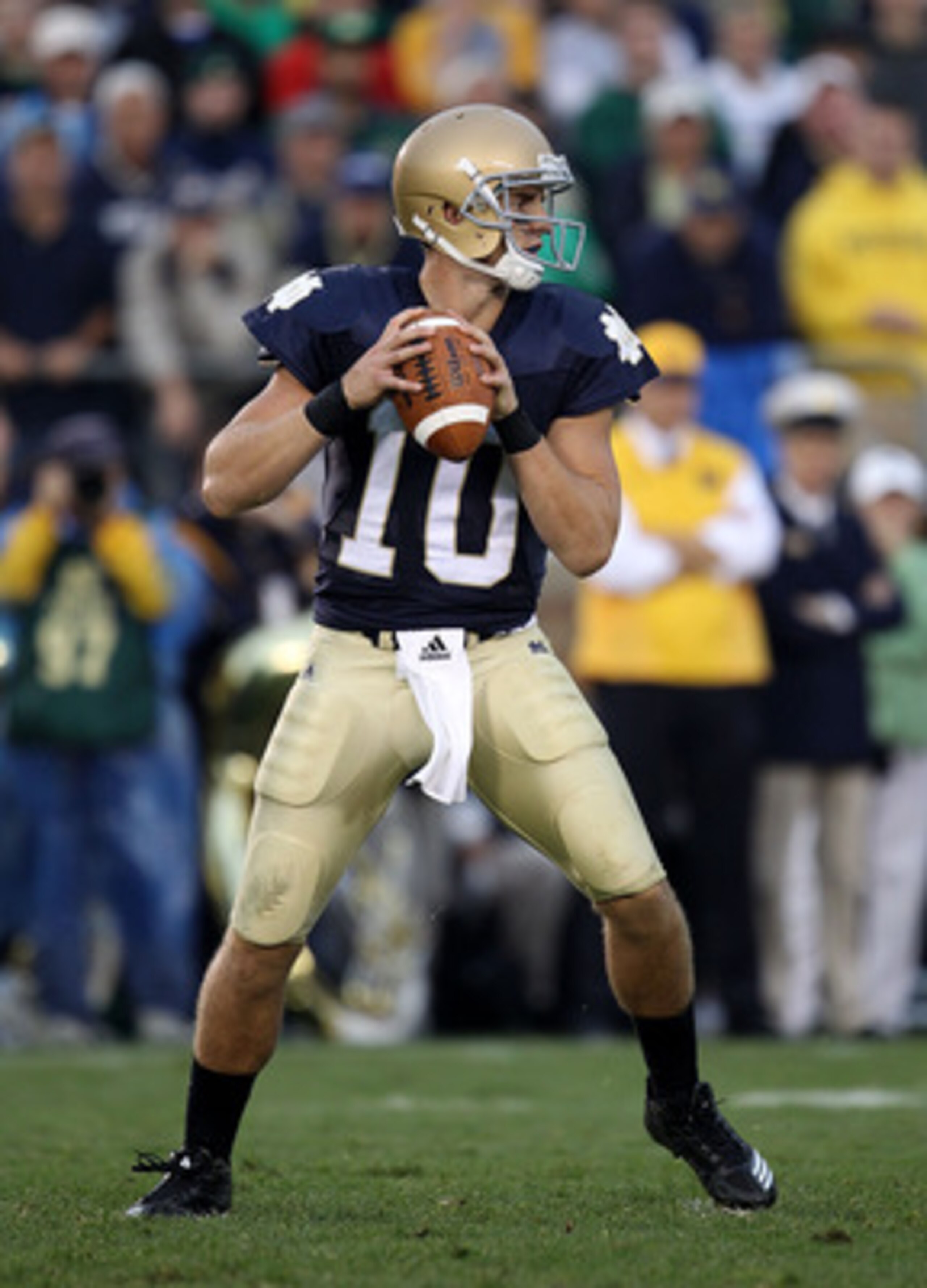 SOUTH BEND, IN - SEPTEMBER 11: Dayne Crist #10 of the Notre Dame Fighting Irish looks for a receiver in the 4th quarter against the Michigan Wolverines at Notre Dame Stadium on September 11, 2010 in South Bend, Indiana. Michigan defeated Notre Dame 28-24.