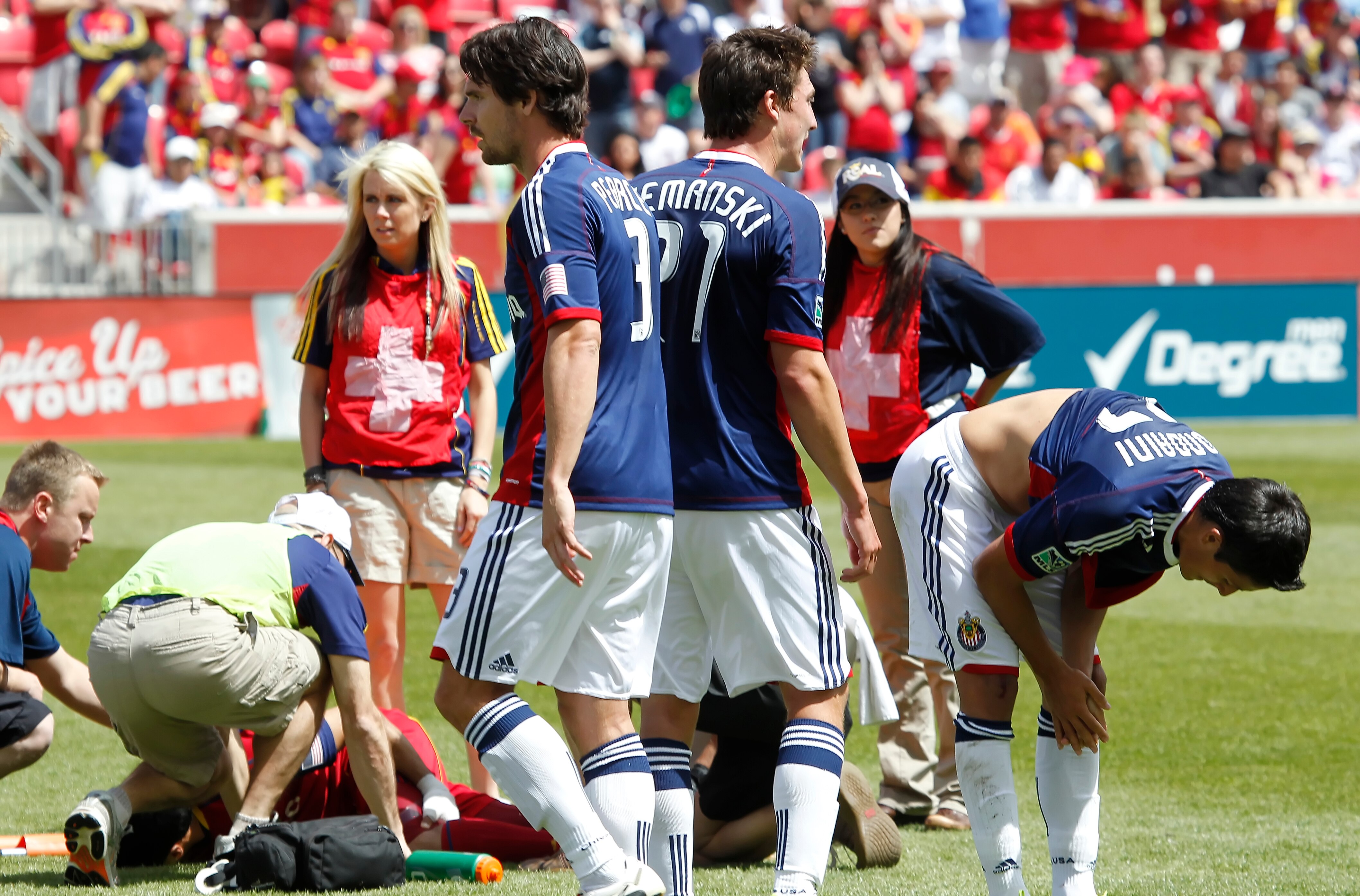 SANDY, UT - MAY 7: Javier Morales #11of Real Salt Lake is looked at by medical officials as Marcos Mondaini #23 (R) of Chivas USA claps his hand and bends over during the first half of an MLS soccer game May 7, 2011 at Rio Tinto Stadium in Sandy, Utah. Mo