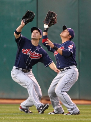 OAKLAND, CA - MAY 03:  Grady Sizemore #24 backs up Shin-Soo Choo #17 of the Cleveland Indians line up to catch a ball hit by Mark Ellis #14 of the Oakland Athletics Oakland-Alameda County Coliseum on May 3, 2011 in Oakland, California.  (Photo by Ezra Sha