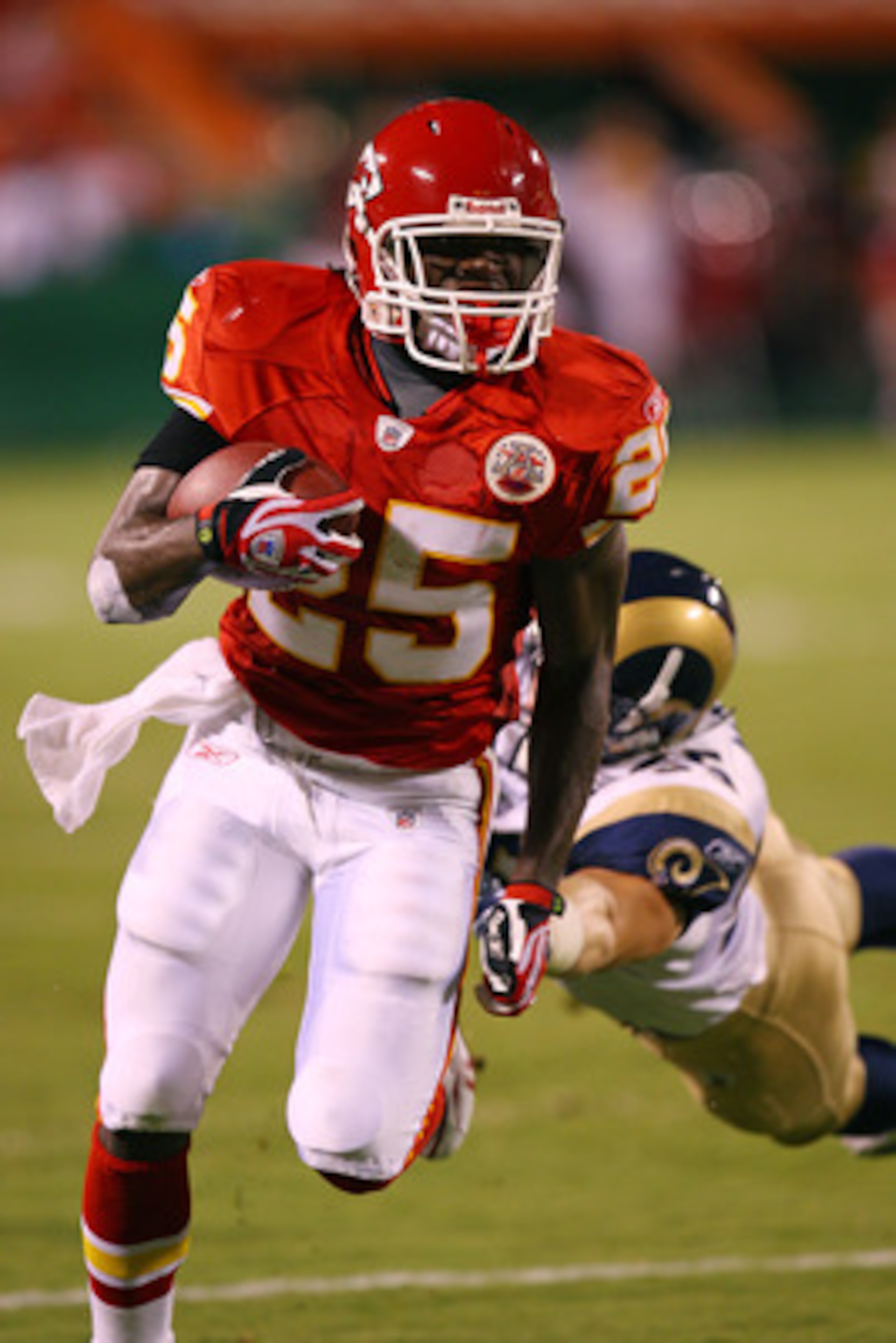 KANSAS CITY, MO - AUGUST 28:  Rookie running back Jamaal Charles #25 of the Kansas City Chiefs eludes a defender during a preseason game against the St. Louis Rams on August 28, 2008 at Arrowhead Stadium in Kansas City, Mo.  (Photo by G. Newman Lowrance/G
