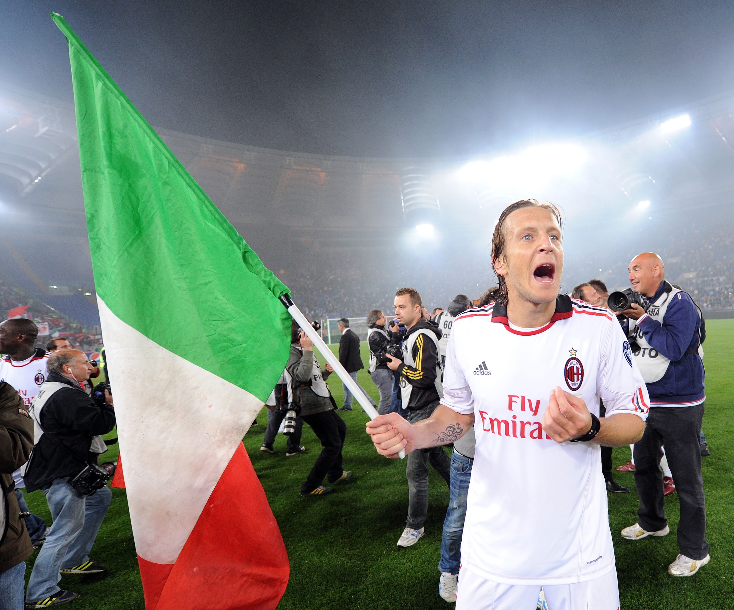 ROME, ITALY - MAY 07:  Massimo Ambrosini of Milan celebrates the victory after the Serie A match between AS Roma and AC Milan at Stadio Olimpico on May 7, 2011 in Rome, Italy.  (Photo by Giuseppe Bellini/Getty Images)