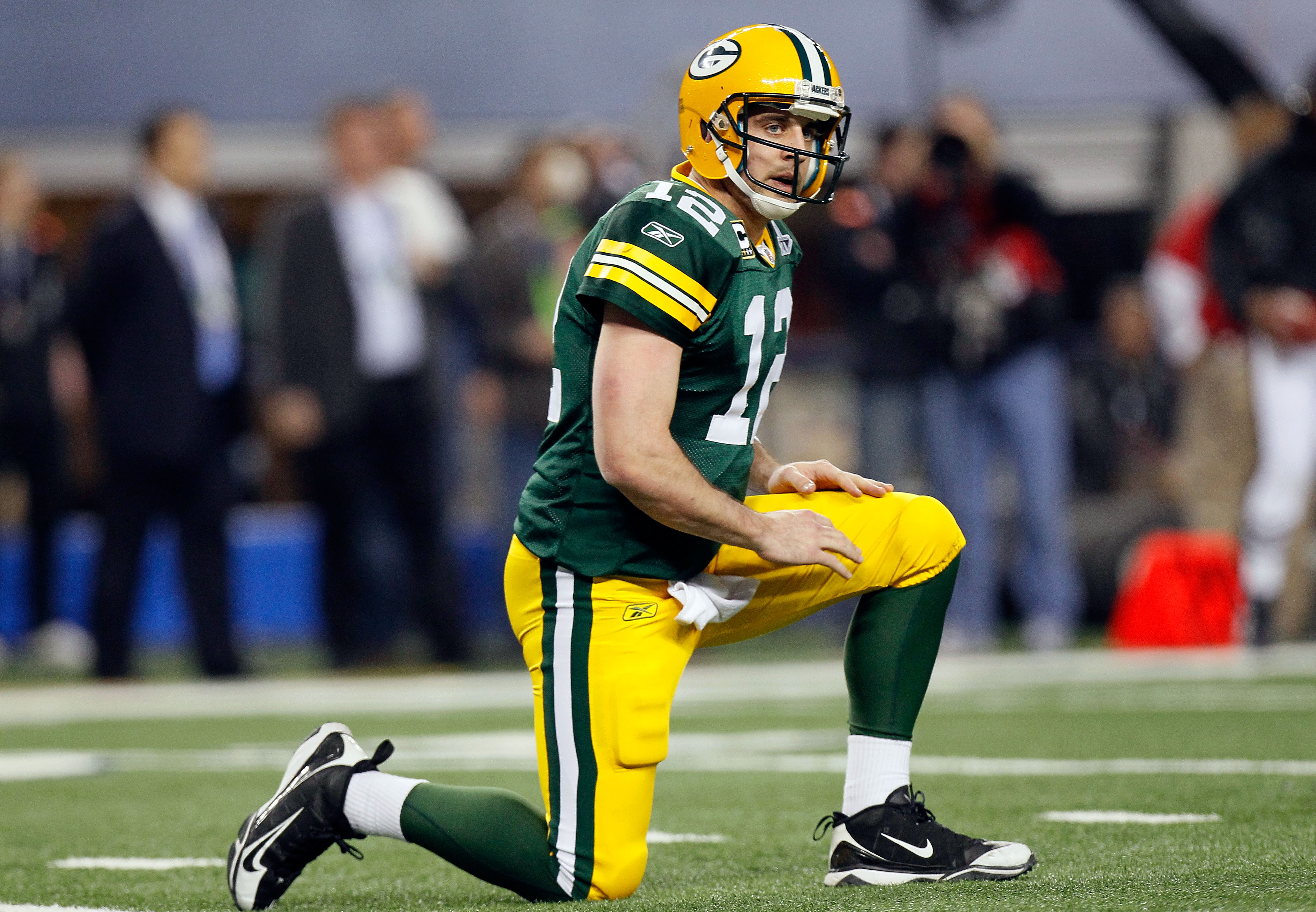 ARLINGTON, TX - FEBRUARY 06: Aaron Rodgers #12 of the Green Bay Packers kneals after being sacked by the Pittsburgh Steelers during Super Bowl XLV at Cowboys Stadium on February 6, 2011 in Arlington, Texas.  (Photo by Kevin C. Cox/Getty Images)
