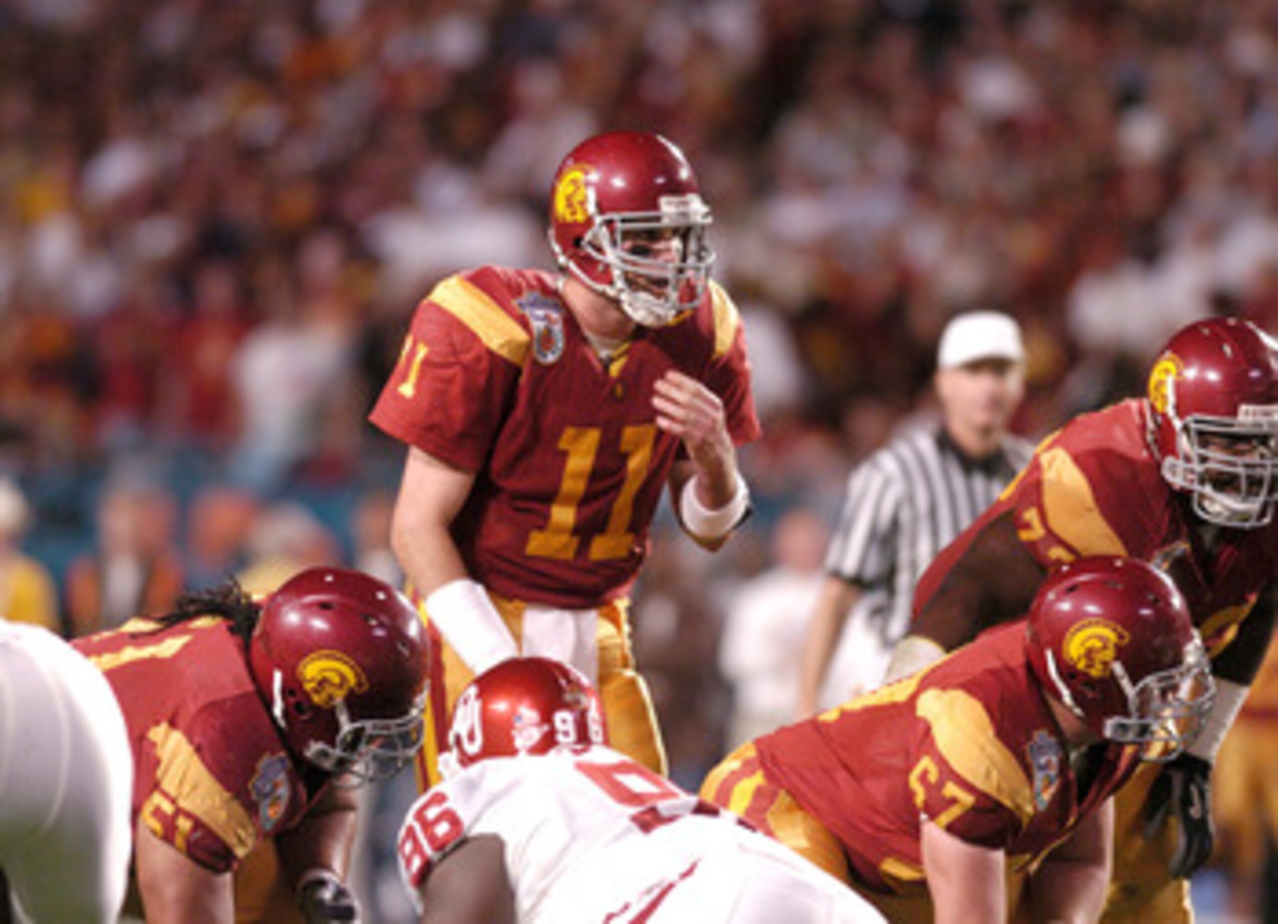 USC quarterback Matt Leinart gets behind the center during the FedEx Orange Bowl National Championship at Pro Player Stadium in Miami, Florida on January 4, 2005. USC beat Oklahoma 55-19. (Photo by A. Messerschmidt/Getty Images)
