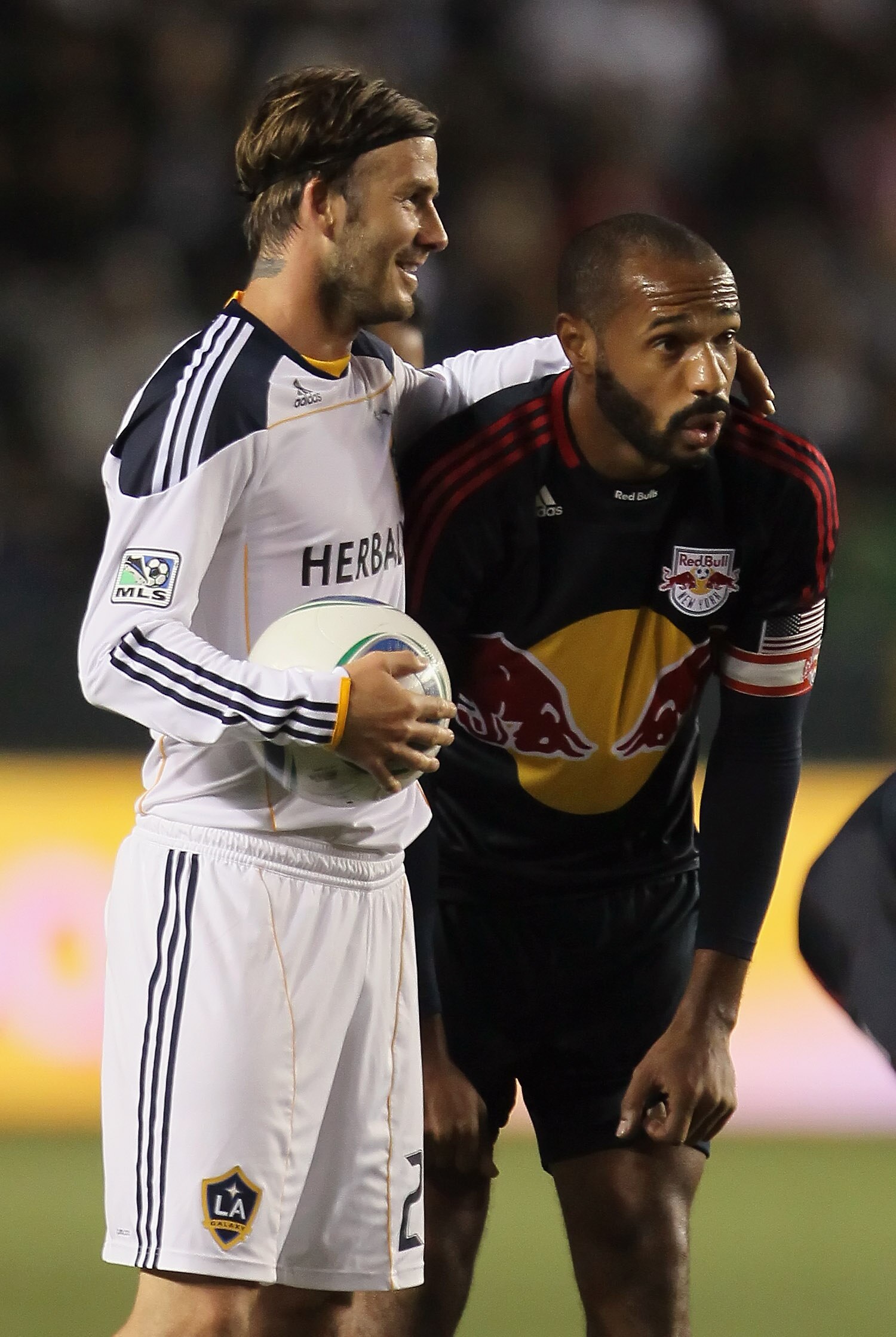 CARSON, CA - MAY 07:  David Beckham (L) #23 of the Los Angeles Galaxy puts his arm around Thierry Henry #14 of the New York Red Bulls in the second half at The Home Depot Center on May 7, 2011 in Carson, California. The Red Bulls and Galaxy played to a 1-
