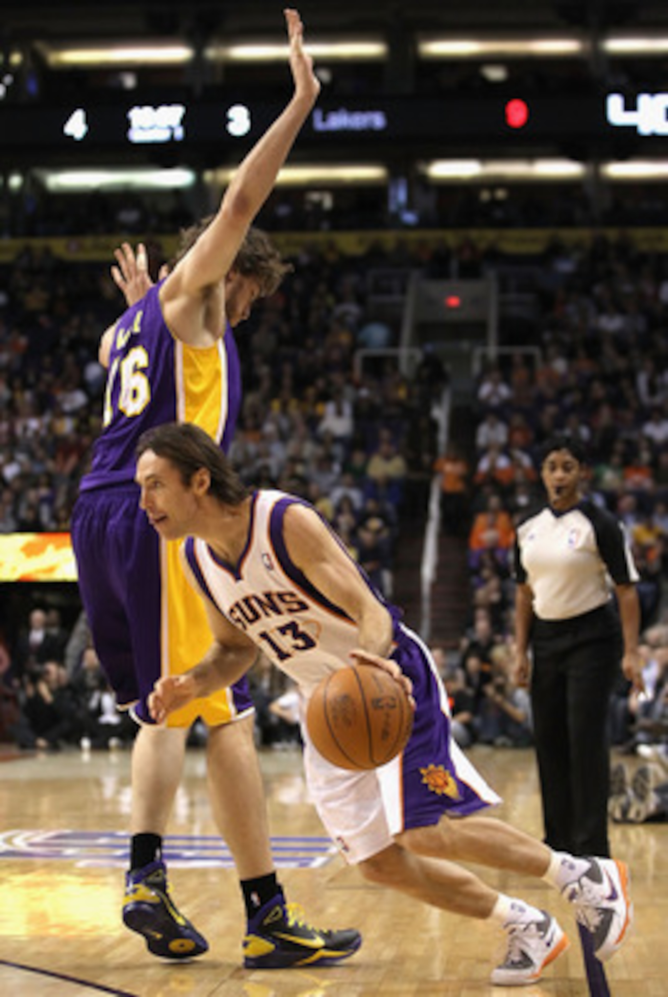 PHOENIX - JANUARY 05: Steve Nash #13 of the Phoenix Suns drives the ball past Pau Gasol #16 of the Los Angeles Lakers during the NBA game at US Airways Center on January 5, 2011 in Phoenix, Arizona. NOTE TO USER: User expressly acknowledges and agrees tha PHOENIX - JANUARY 05: Steve Nash #13 of the Phoenix Suns drives the ball past Pau Gasol #16 of the Los Angeles Lakers during the NBA game at US Airways Center on January 5, 2011 in Phoenix, Arizona. NOTE TO USER: User expressly acknowledges and agrees tha