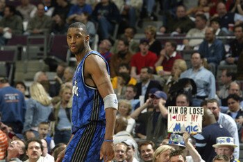 AUBURN HILLS, MI - APRIL 23:  Tracy McGrady #1 of the Orlando Magic looks back as he walks to the bench during play against the Detroit Pistons in Game two of the Eastern Conference Quarterfinals during the 2003 NBA Playoffs at The Palace of Auburn Hills 