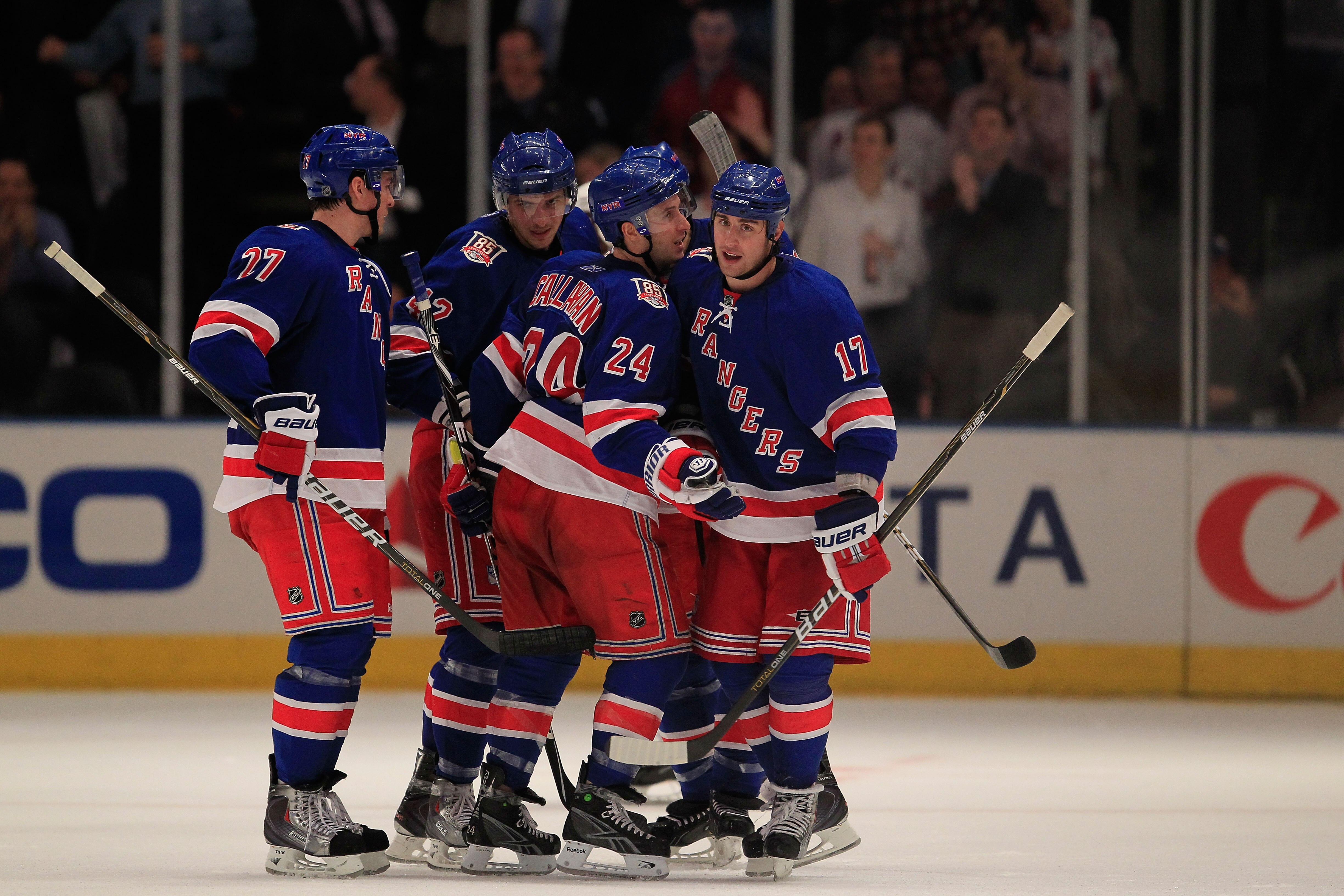 NEW YORK, NY - FEBRUARY 17:  Brandon Dubinsky #17 of the New York Rangers is congratulated by his teammates for his goal in the third period against the Los Angeles Kings on February 17, 2011 in New York City. The Rangers defeated the Kings 4-3 after a sh