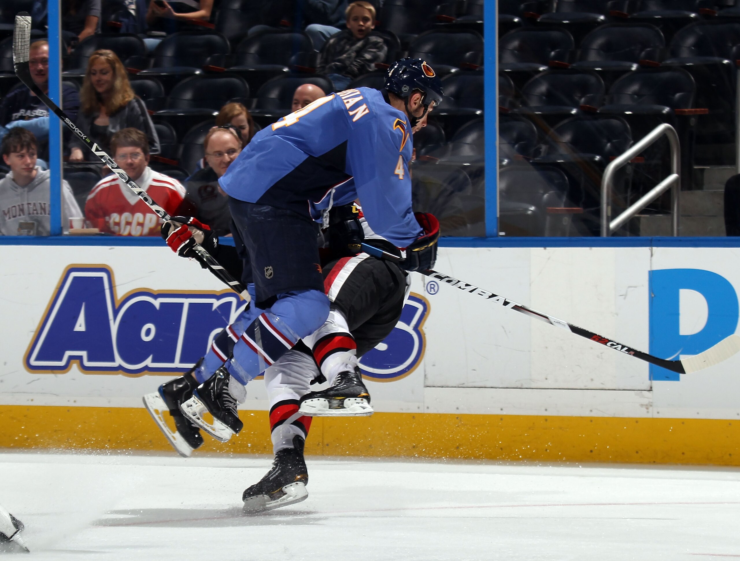 ATLANTA, GA - MARCH 27: Zach Bogosian #4 of the Atlanta Thrashers hits Erik Condra #38 of the Ottawa Senators at the Philips Arena on March 27, 2011 in Atlanta, Georgia. The Thrashers defeated the Senators 5-4 in the shoot out. (Photo by Bruce Bennett/Get