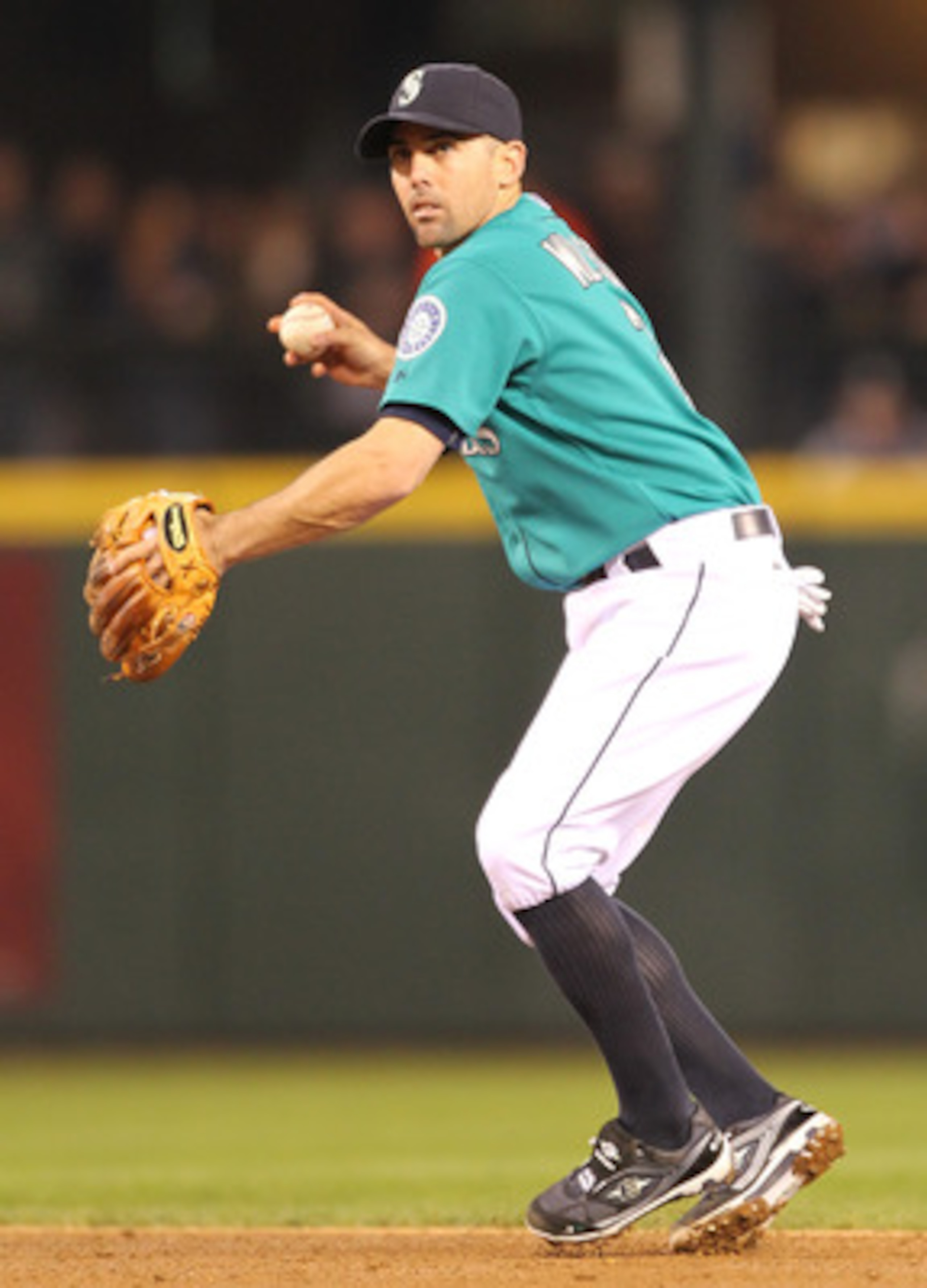 SEATTLE - MAY 06:  Jack Wilson #2 of the Seattle Mariners throws to first against the Chicago White Sox at Safeco Field on May 6, 2011 in Seattle, Washington. The Mariners won 3-2. (Photo by Otto Greule Jr/Getty Images)