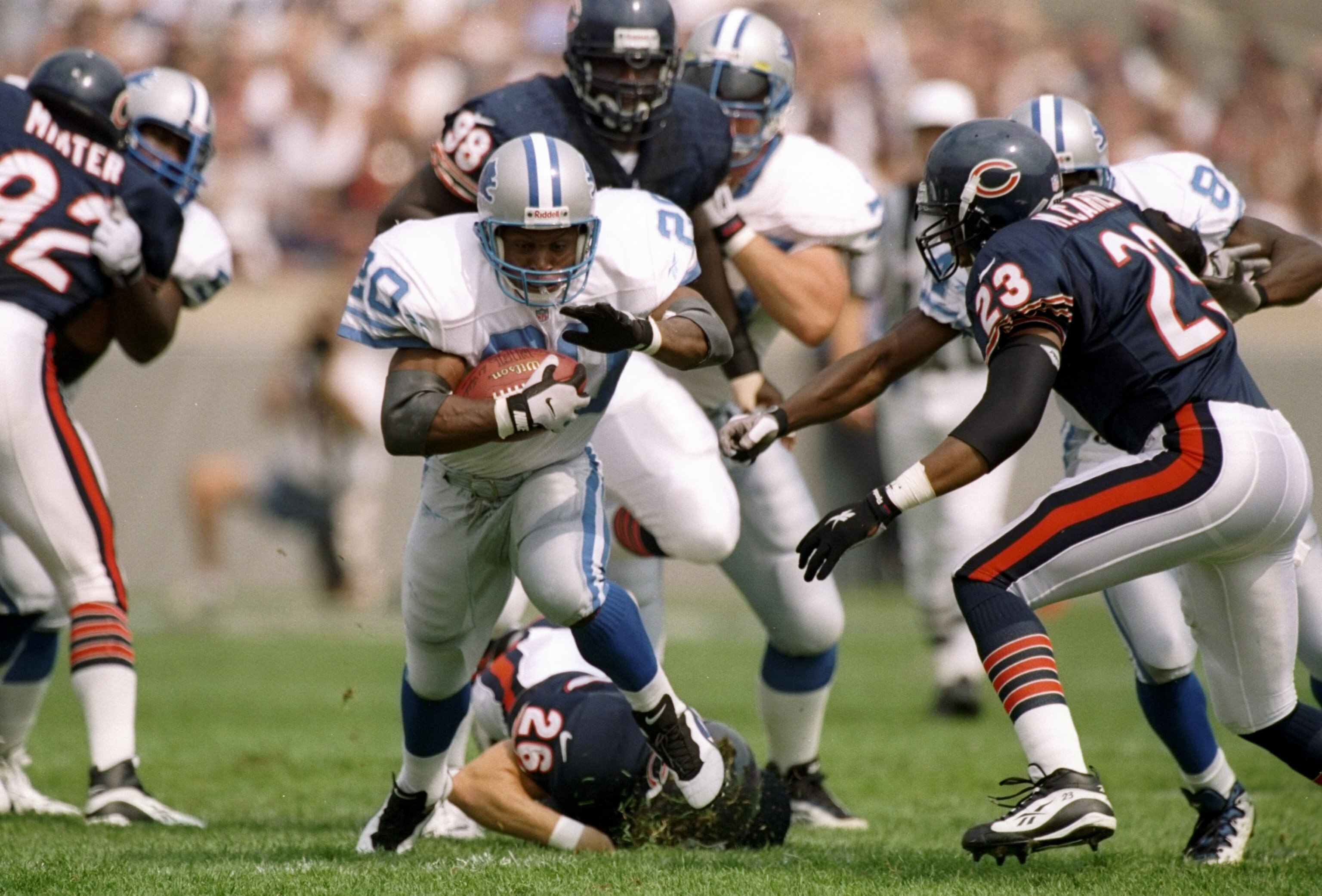 14 Sep 1997:  Running back Barry Sanders of the Detroit Lions moves the ball during a game against the Chicago Bears at Soldier Field in Chicago, Illinois.  The Lions won the game, 32-7. Mandatory Credit: Jonathan Daniel  /Allsport