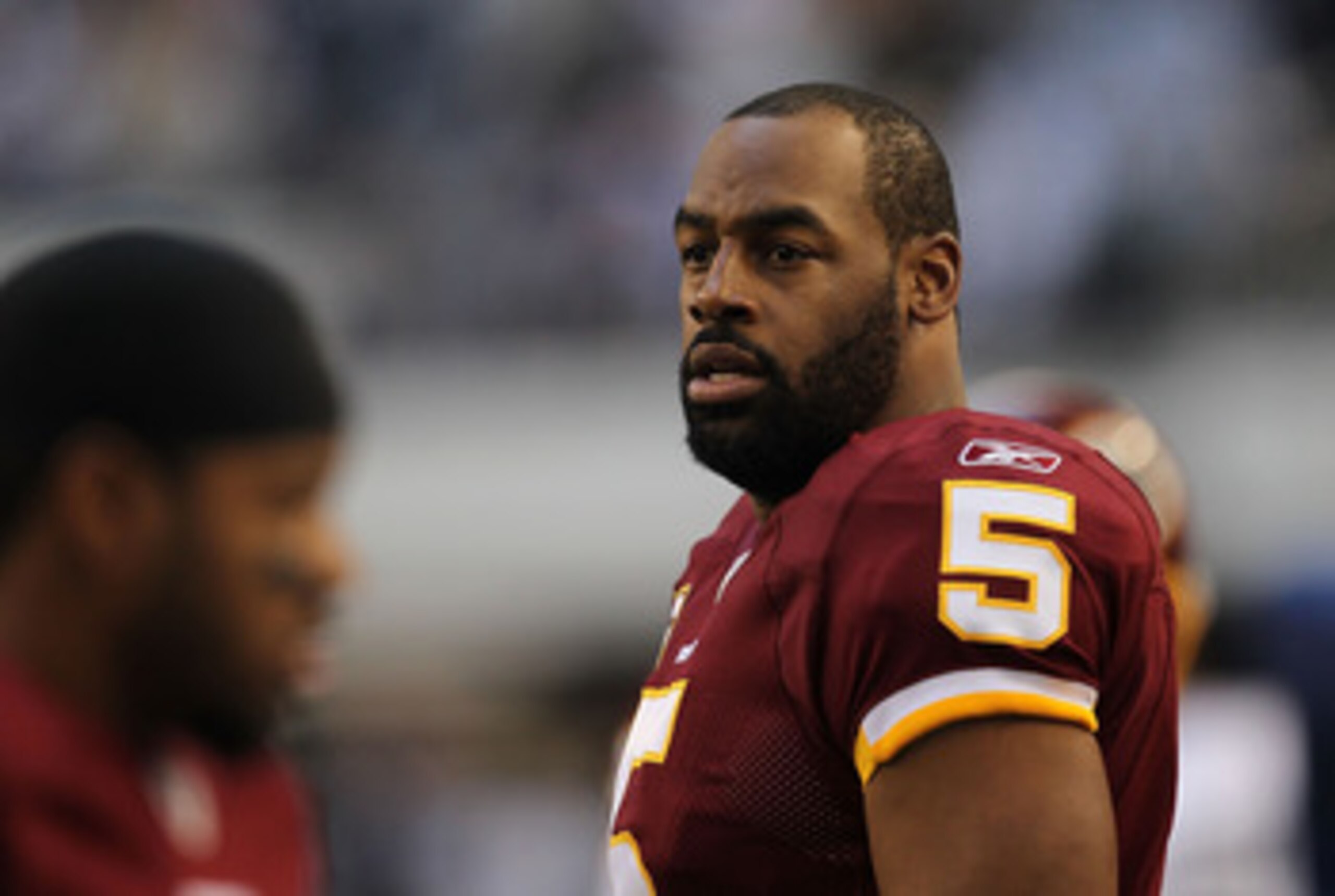 ARLINGTON, TX - DECEMBER 19:  Quarterback Donovan McNabb #5  of the Washington Redskins on the sidelines against play against the Dallas Cowboys at Cowboys Stadium on December 19, 2010 in Arlington, Texas.  (Photo by Ronald Martinez/Getty Images)